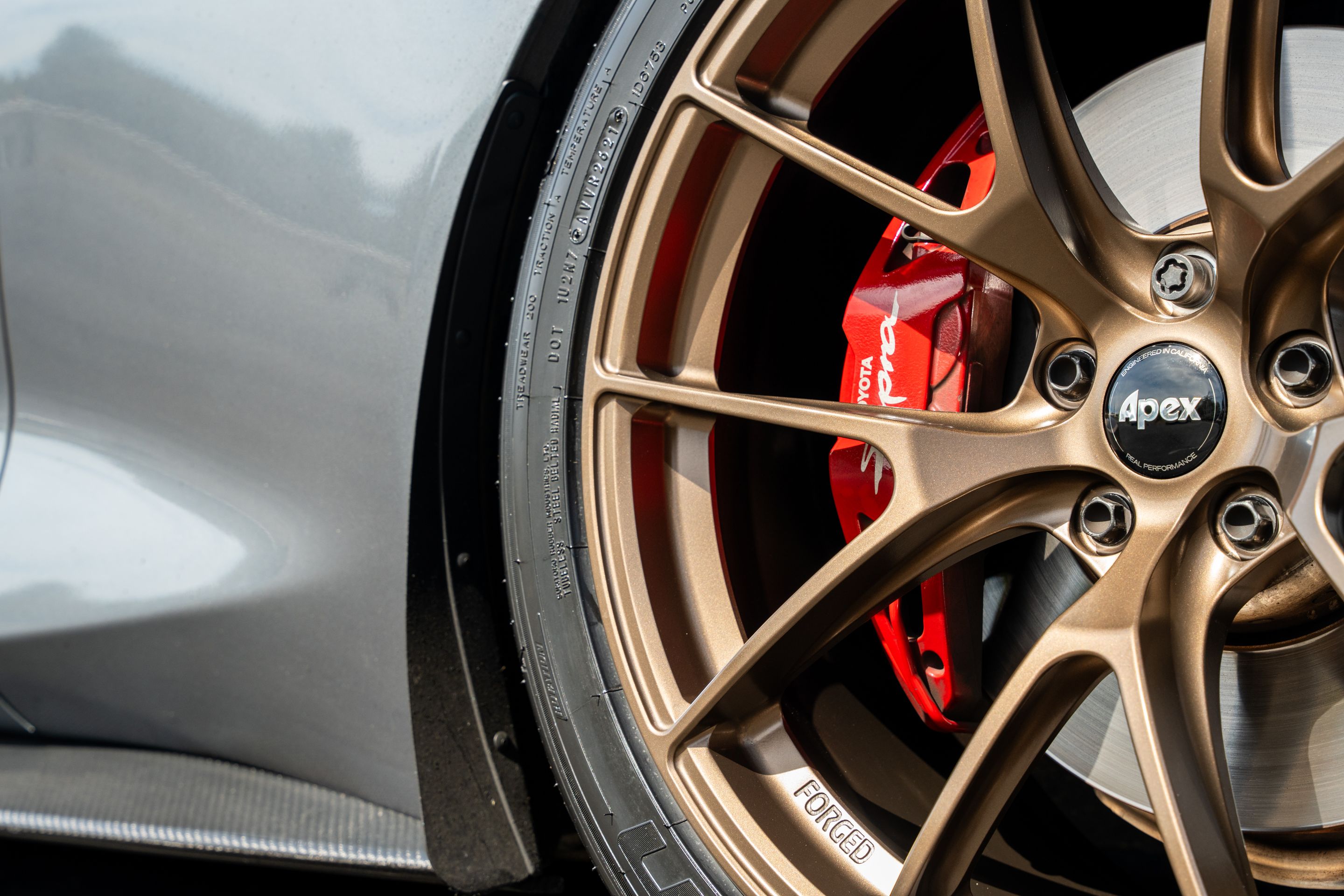 Grey Toyota GR Supra with 19" VS-5RS Apex wheels in Satin Bronze
