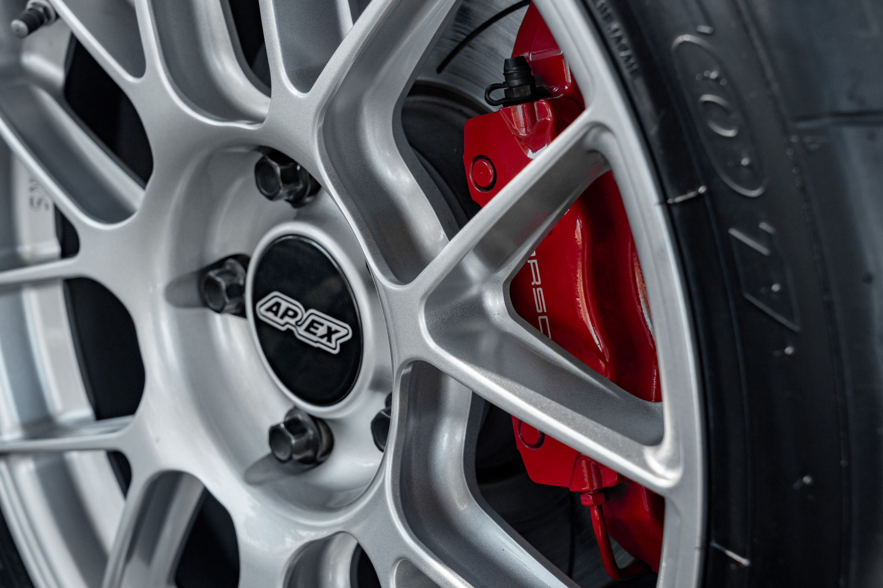 White Porsche 987 Cayman R with 18" EC-7RS Apex wheels in Race Silver