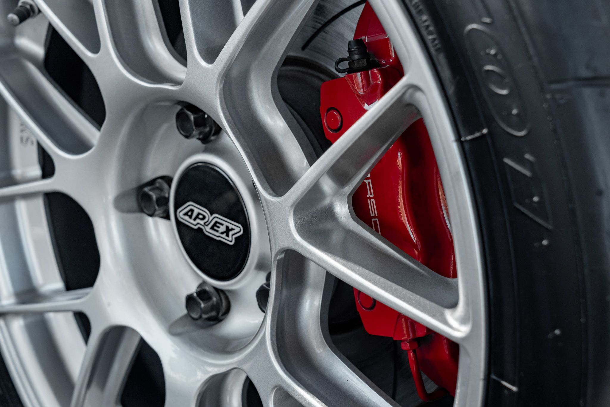 White Porsche 987 Cayman R with 18" EC-7RS Apex wheels in Race Silver