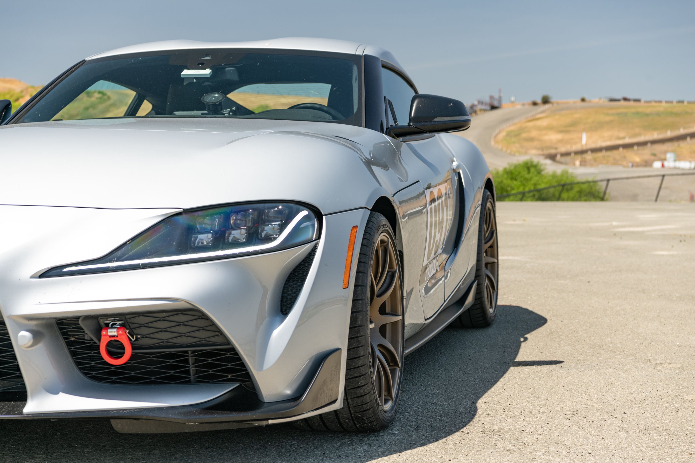 Silver Toyota GR Supra with 19" SM-10 Apex wheels in Satin Bronze