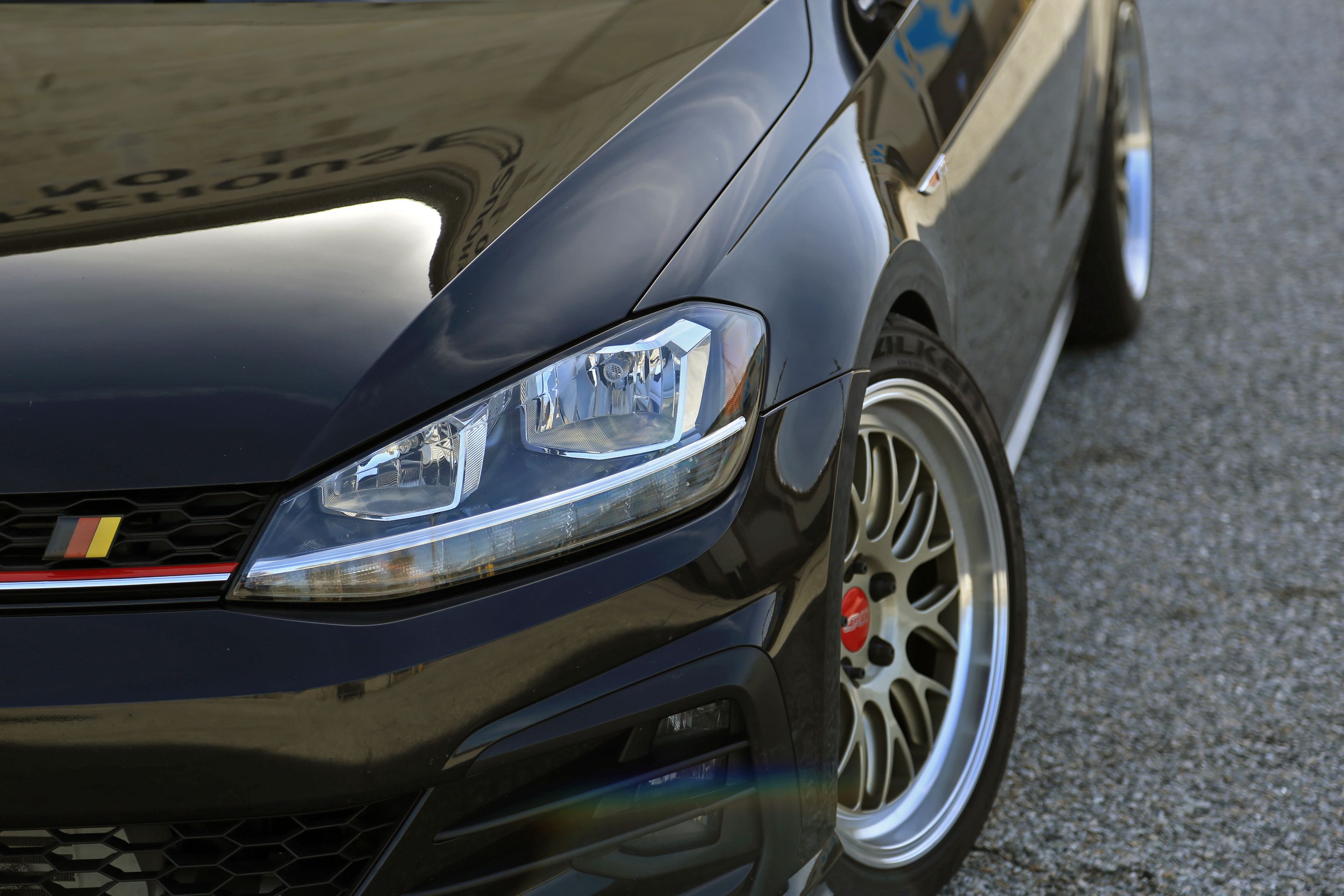 Black VW MK7 GTI with 18" ML-10RT Apex wheels in Machined Lip Gloss Motorsport Gold