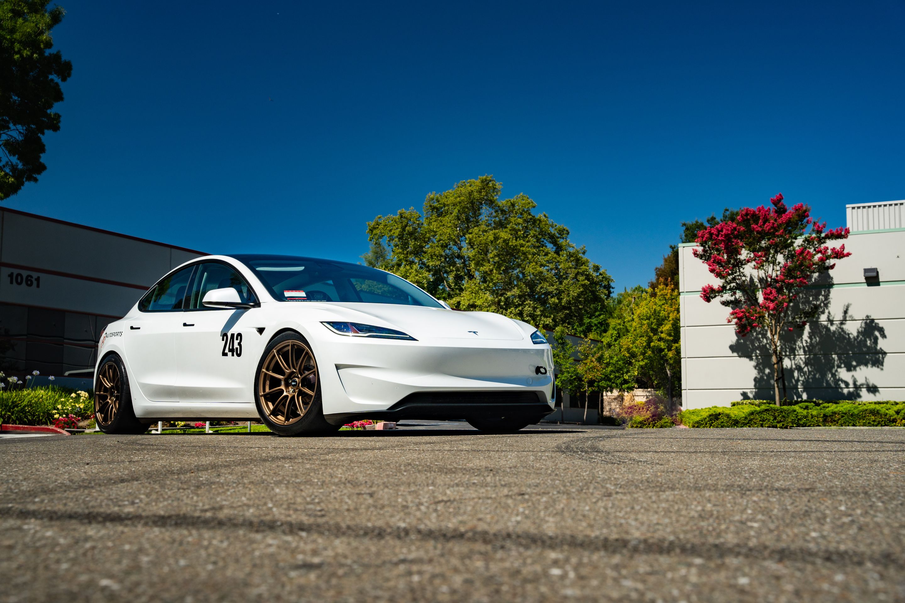 White Tesla Model 3 with 19" SM-10RS Apex wheels in Satin Bronze