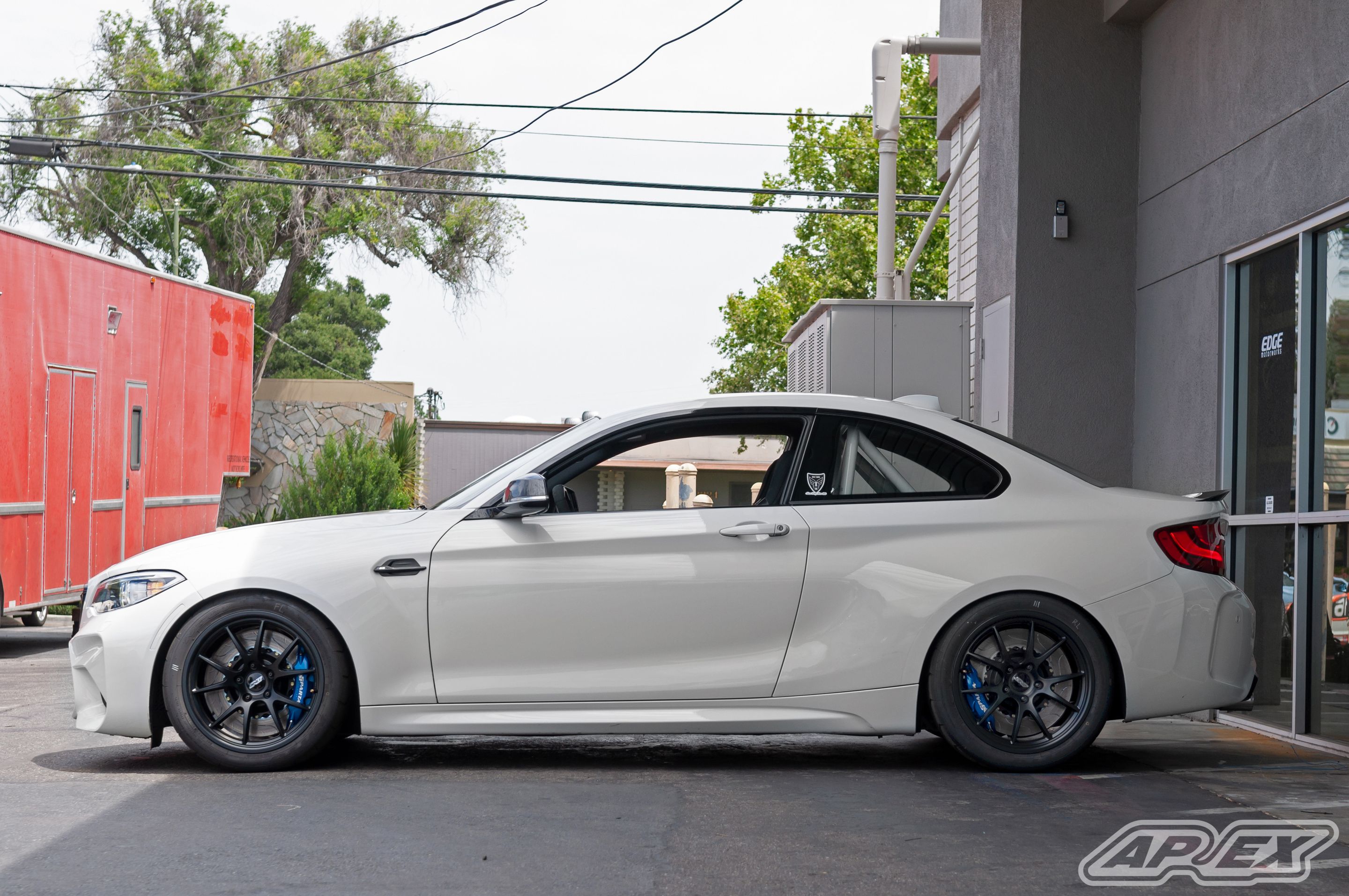 White BMW F87 M2 with 18" FL-5 Apex wheels in Satin Black