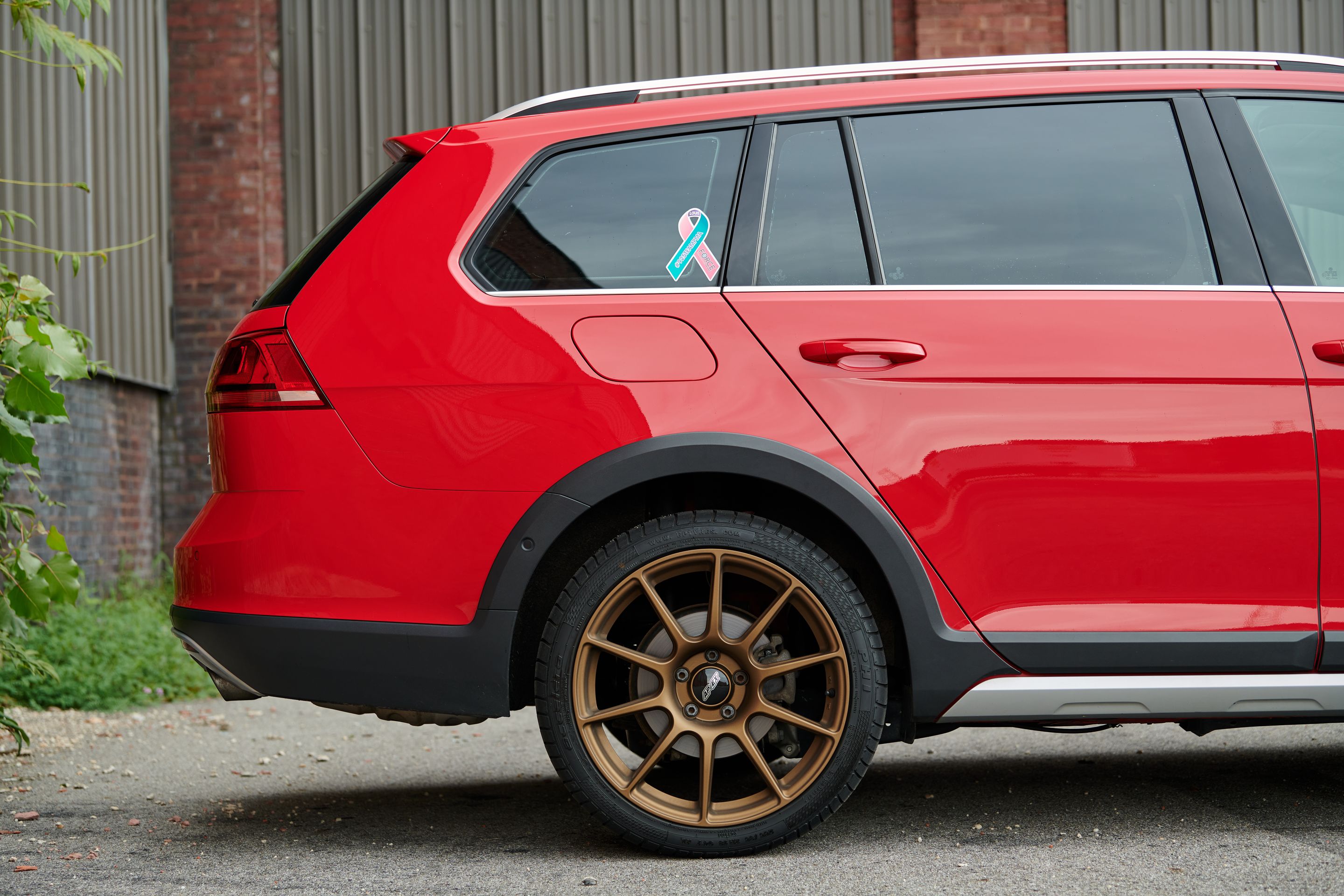 Red VW MK7 Alltrack/SportWagen Alltrack with 18" SM-10 Apex wheels in Satin Bronze