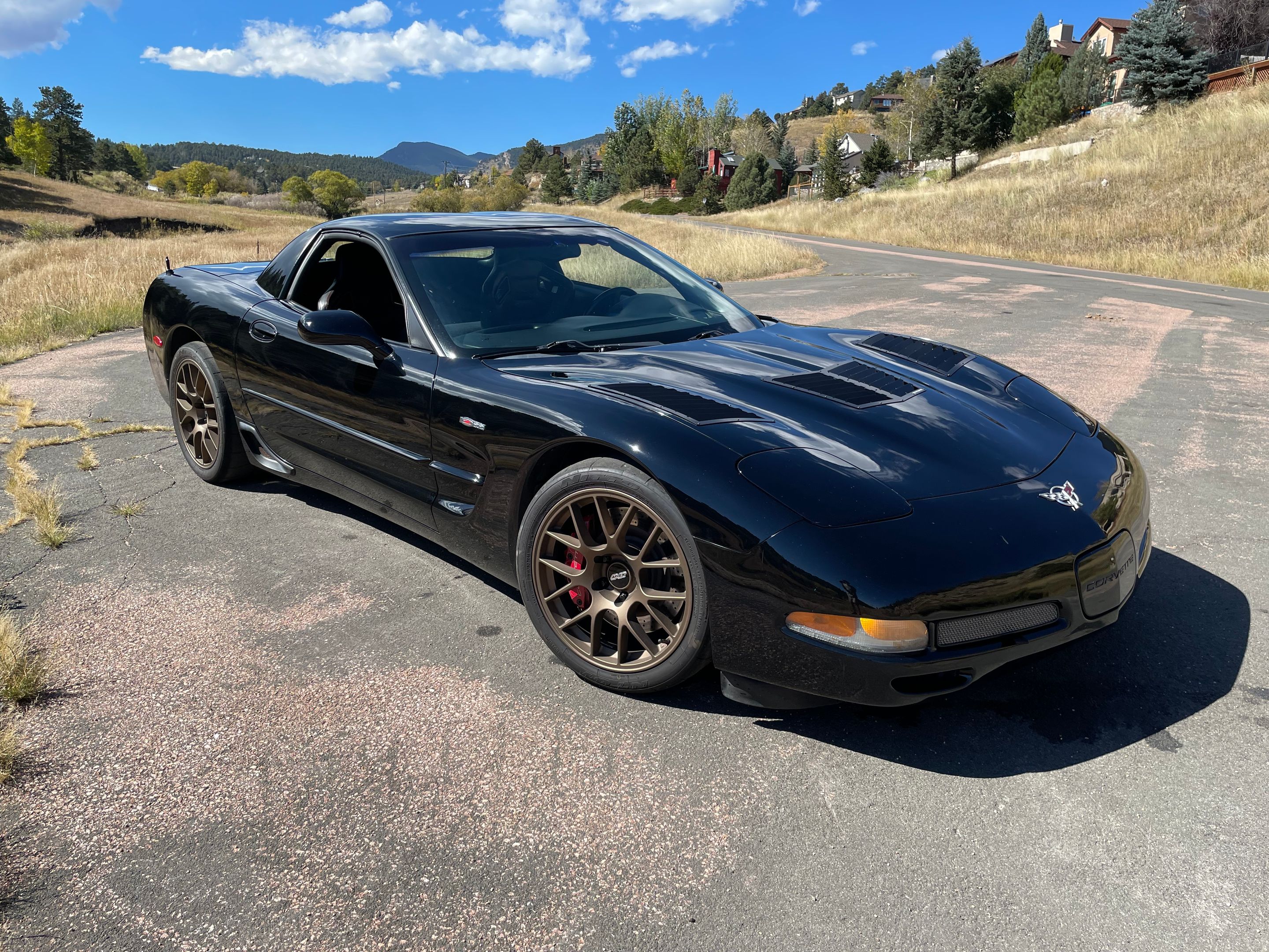 Black Chevrolet C5 Corvette Z06 with 18" EC-7 Apex wheels in Satin Bronze