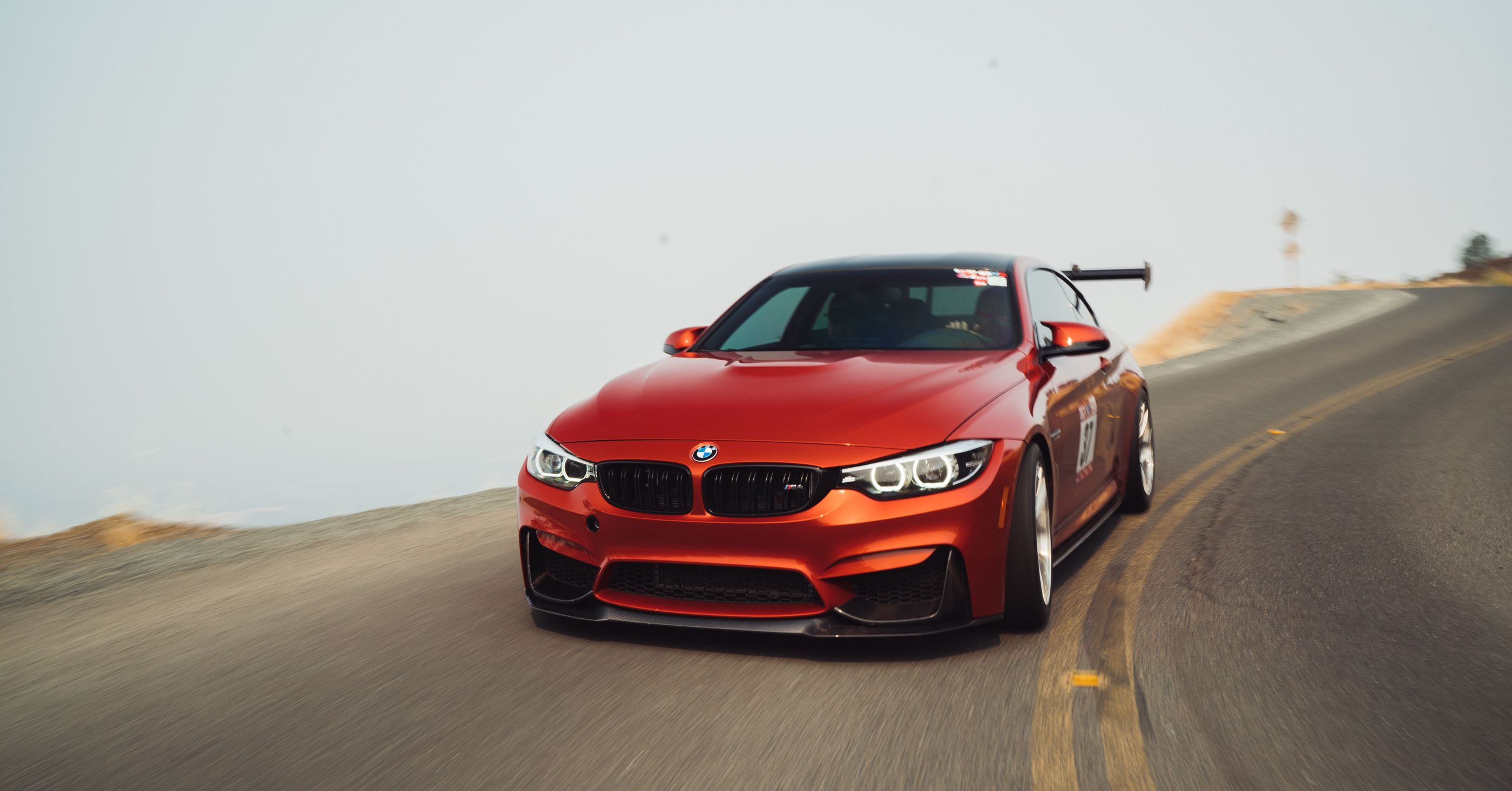 Orange BMW F82 Coupe M4 with 18" VS-5RS Apex wheels in Brushed Clear