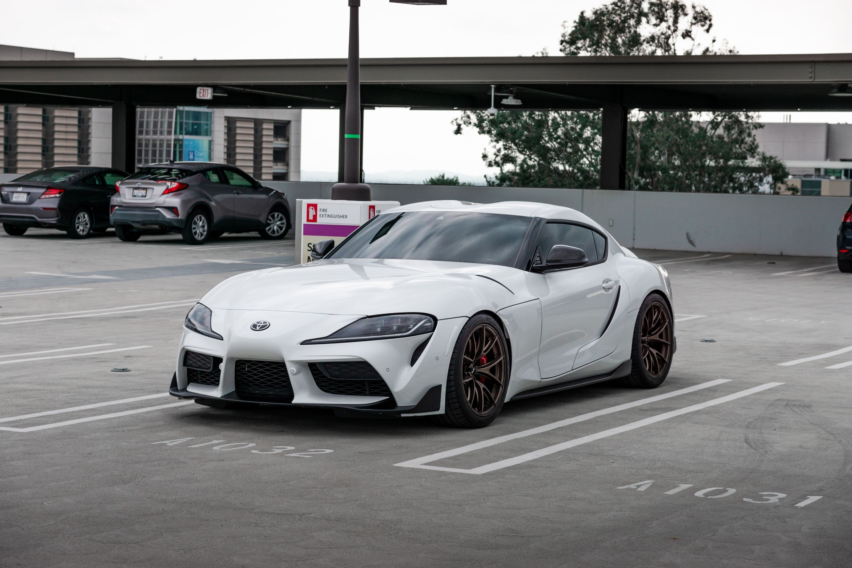 White Toyota GR Supra with 19" VS-5RS Apex wheels in Satin Bronze