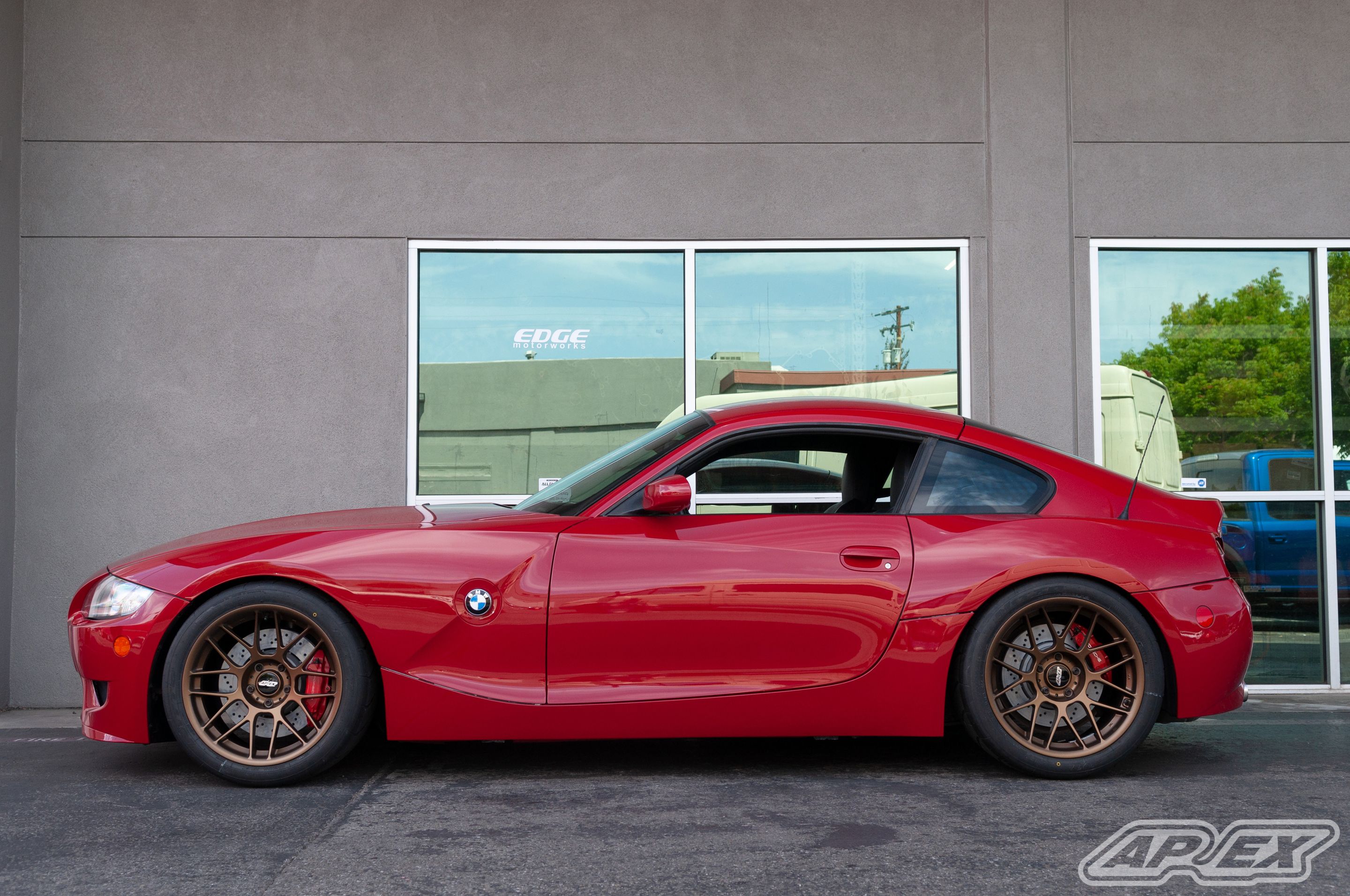 Red BMW E86 Coupe Z4 M with 18" ARC-8 Apex wheels in Satin Bronze