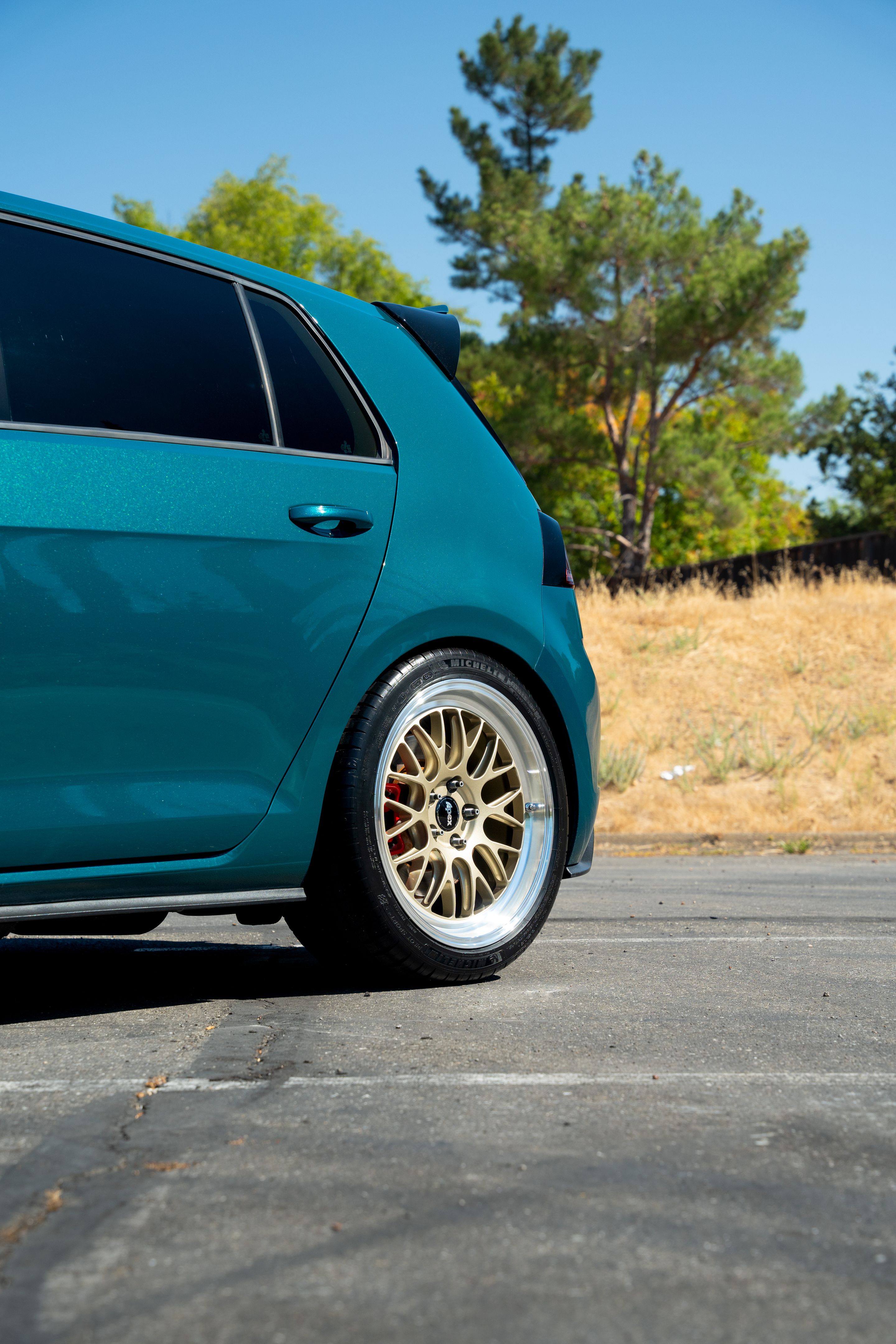 Green VW MK7 GTI with 18" ML-10RT Apex wheels in Machined Lip Gloss Motorsport Gold