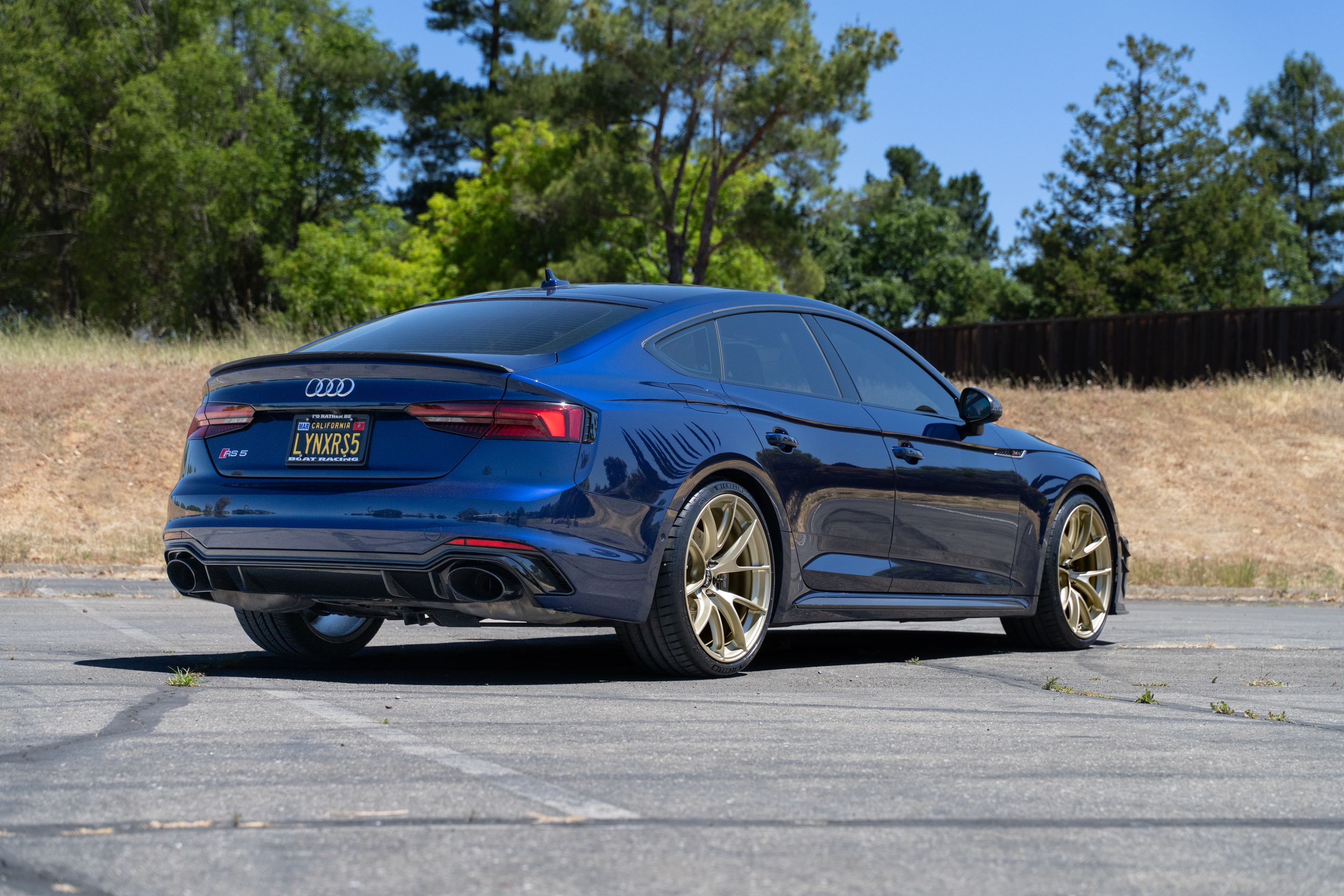 Blue Audi B9 RS 5 Sportback with 20" VS-5RS Apex wheels in Motorsport Gold