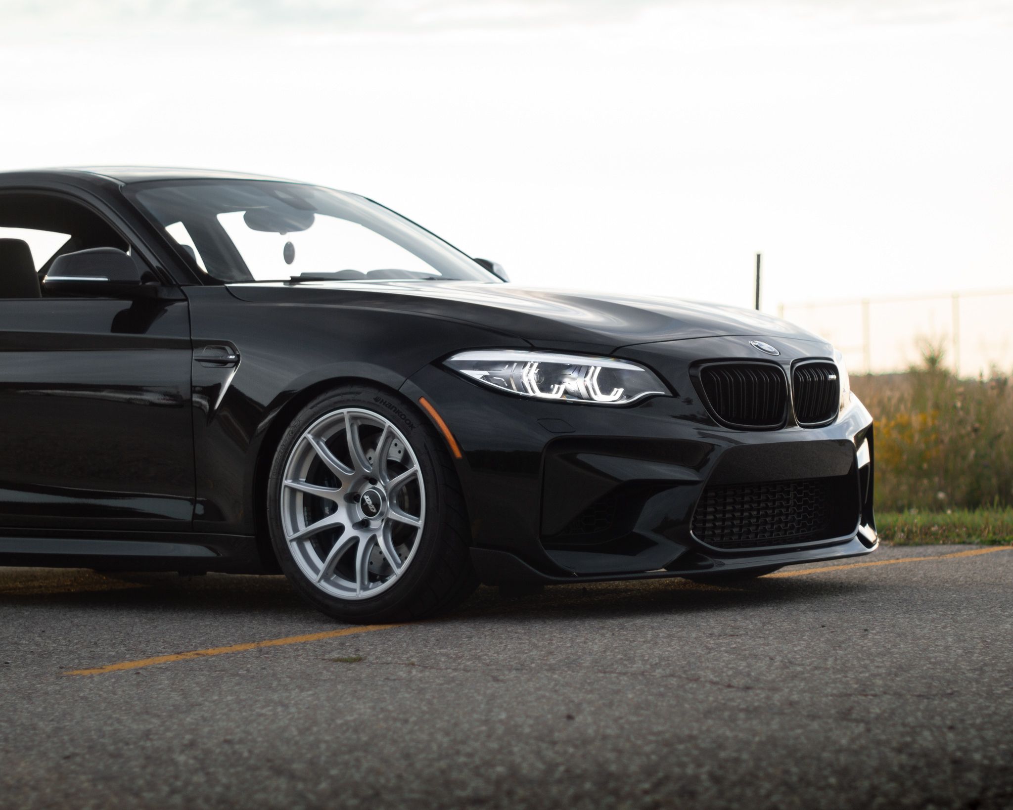 Black BMW F87 M2 with 18" SM-10 Apex wheels in Race Silver