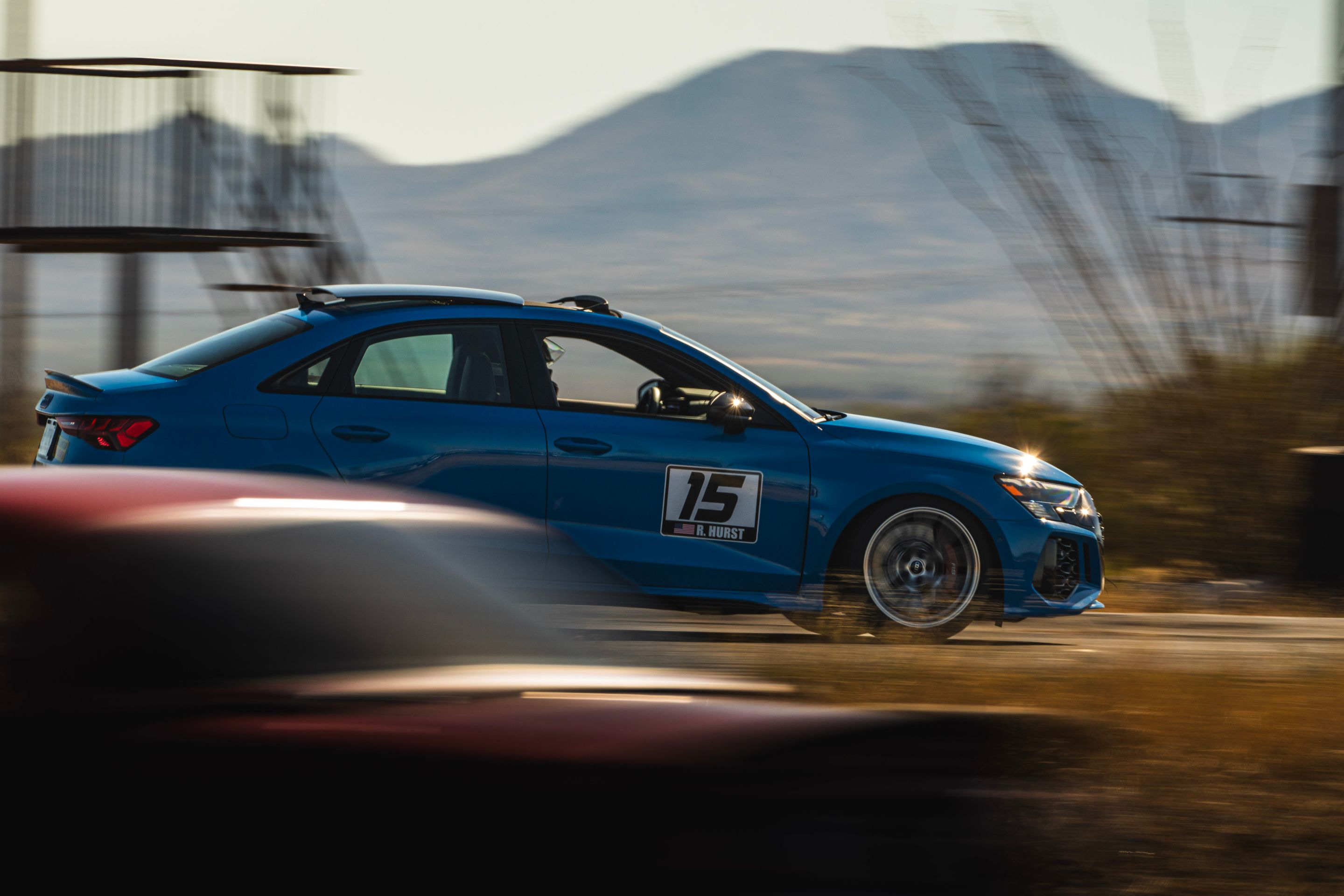 Blue Audi 8Y RS 3 with 18" VS-5RS Apex wheels in Brushed Clear