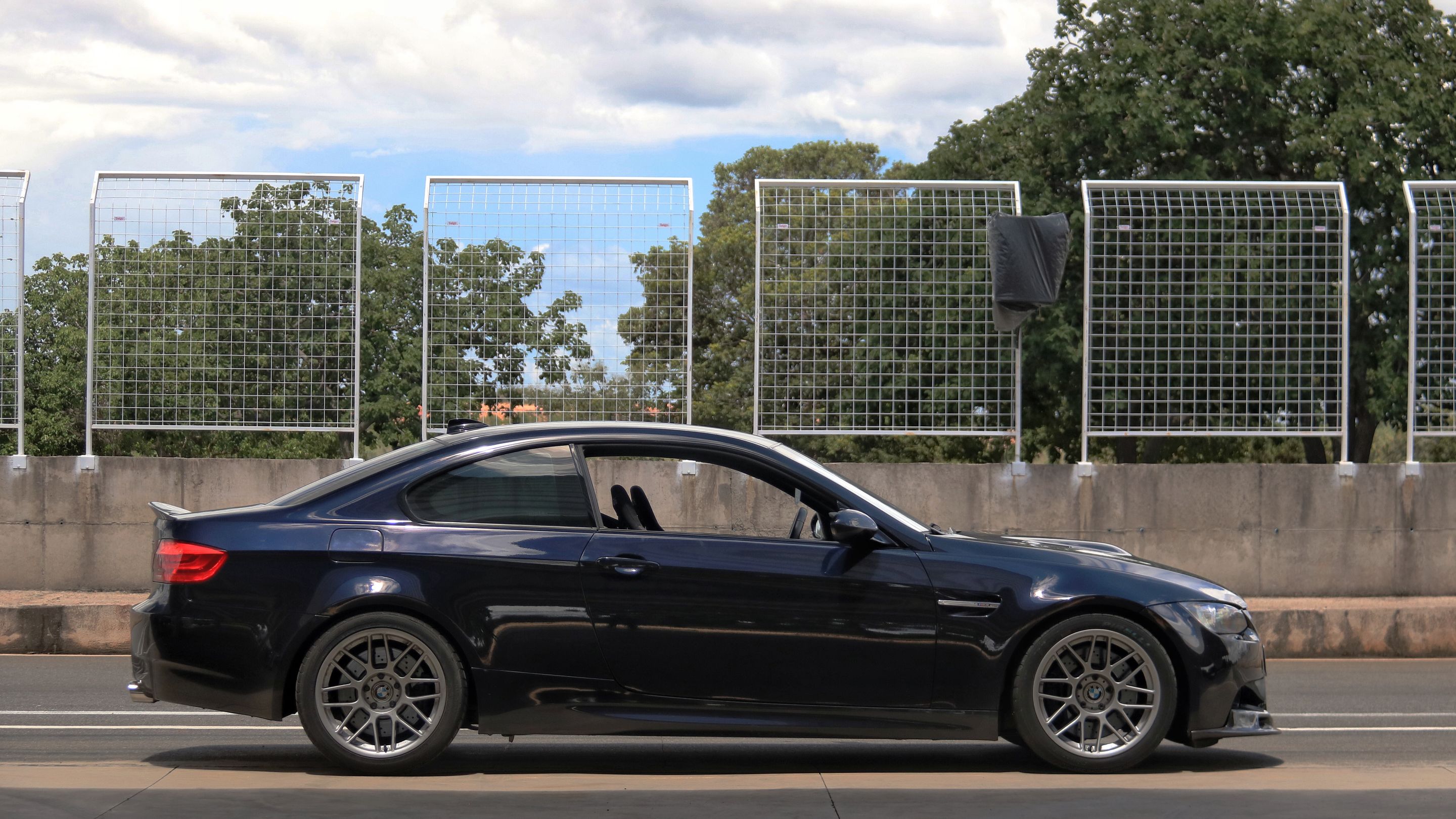 Black BMW E92 Coupe M3 with 18" ARC-8 Apex wheels in Hyper Silver