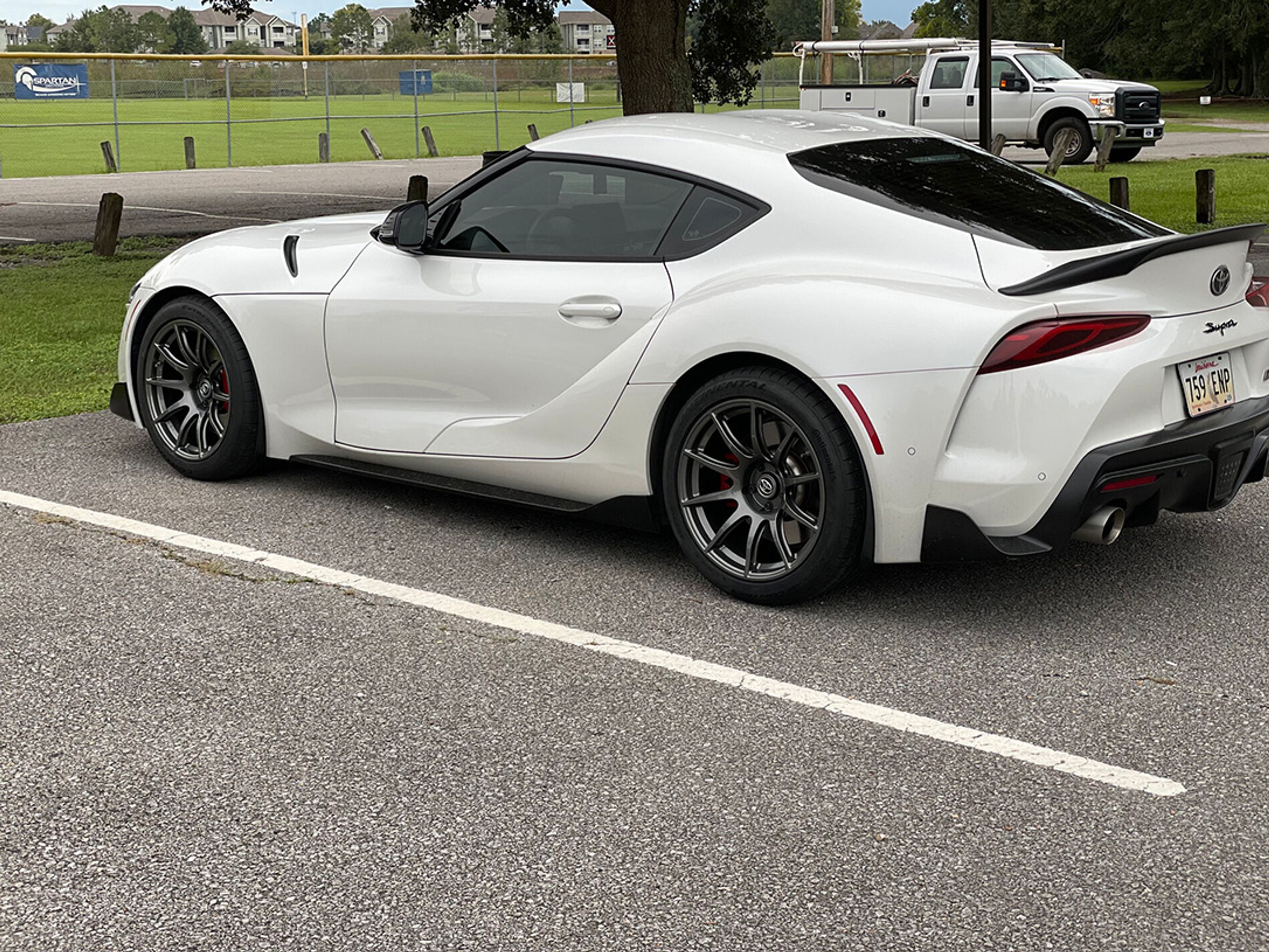 White Toyota GR Supra with 18" SM-10 Apex wheels in Anthracite