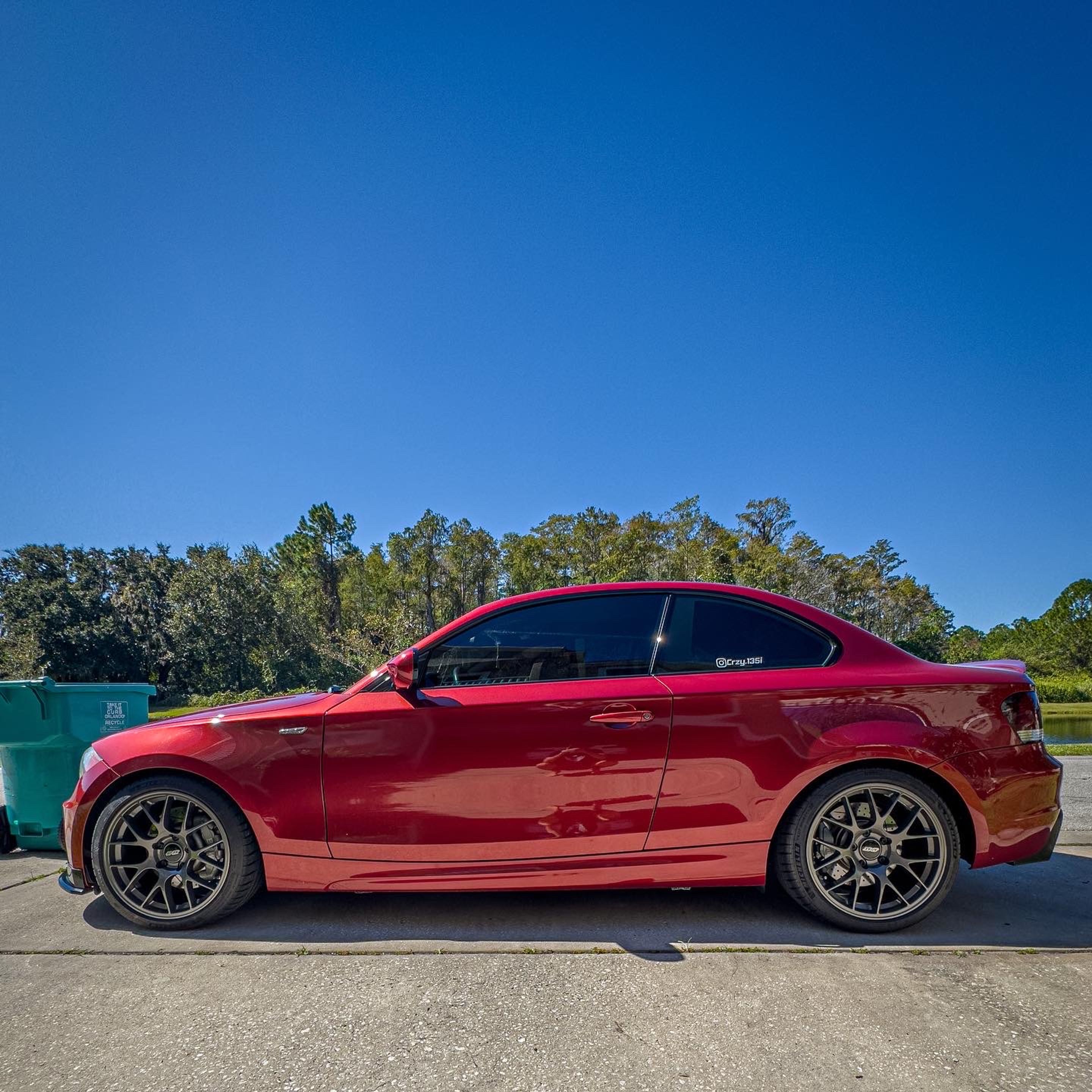 Orange BMW E82 Coupe 1 Series with 18" EC-7 Apex wheels in Anthracite