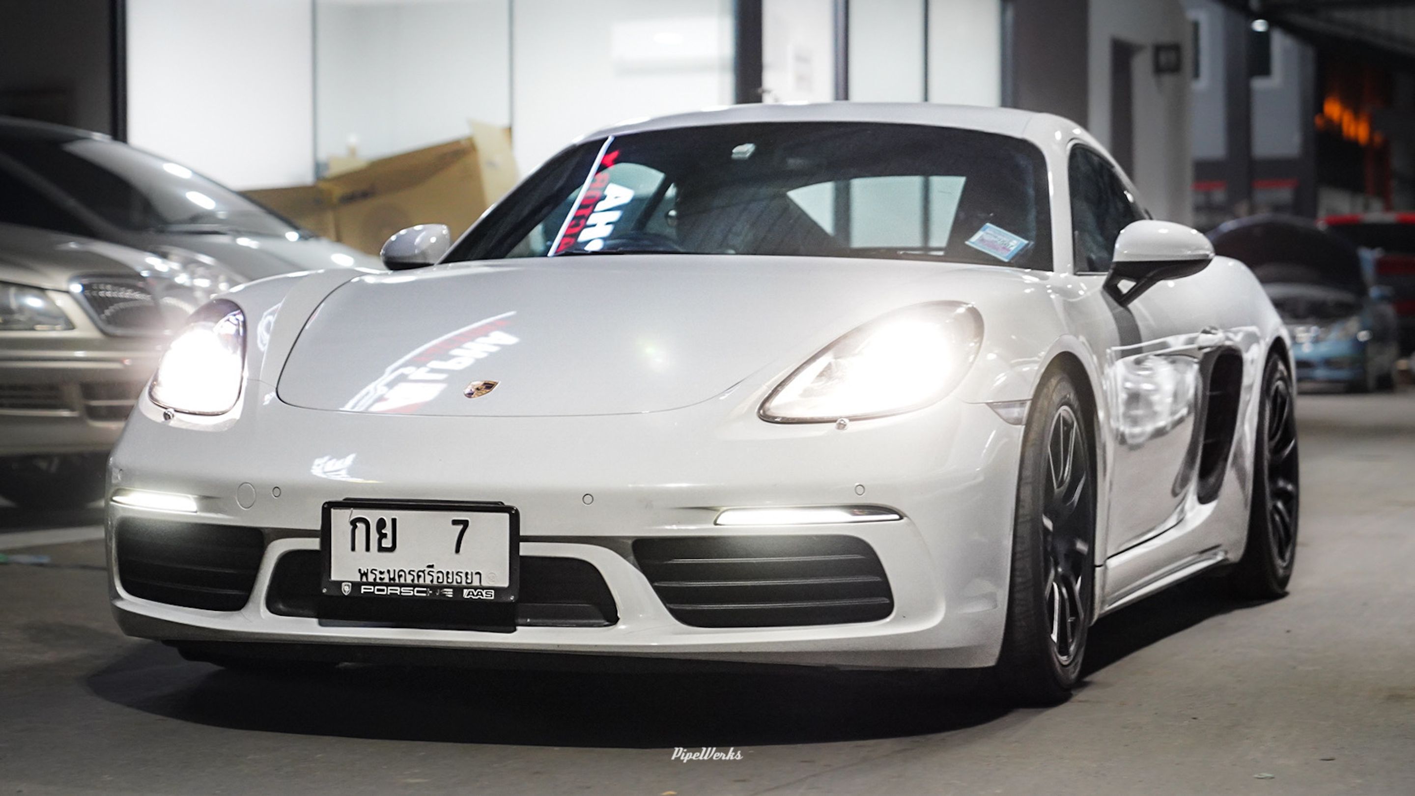 White Porsche 718 Cayman Base with 18" SM-10 Apex wheels in Satin Black