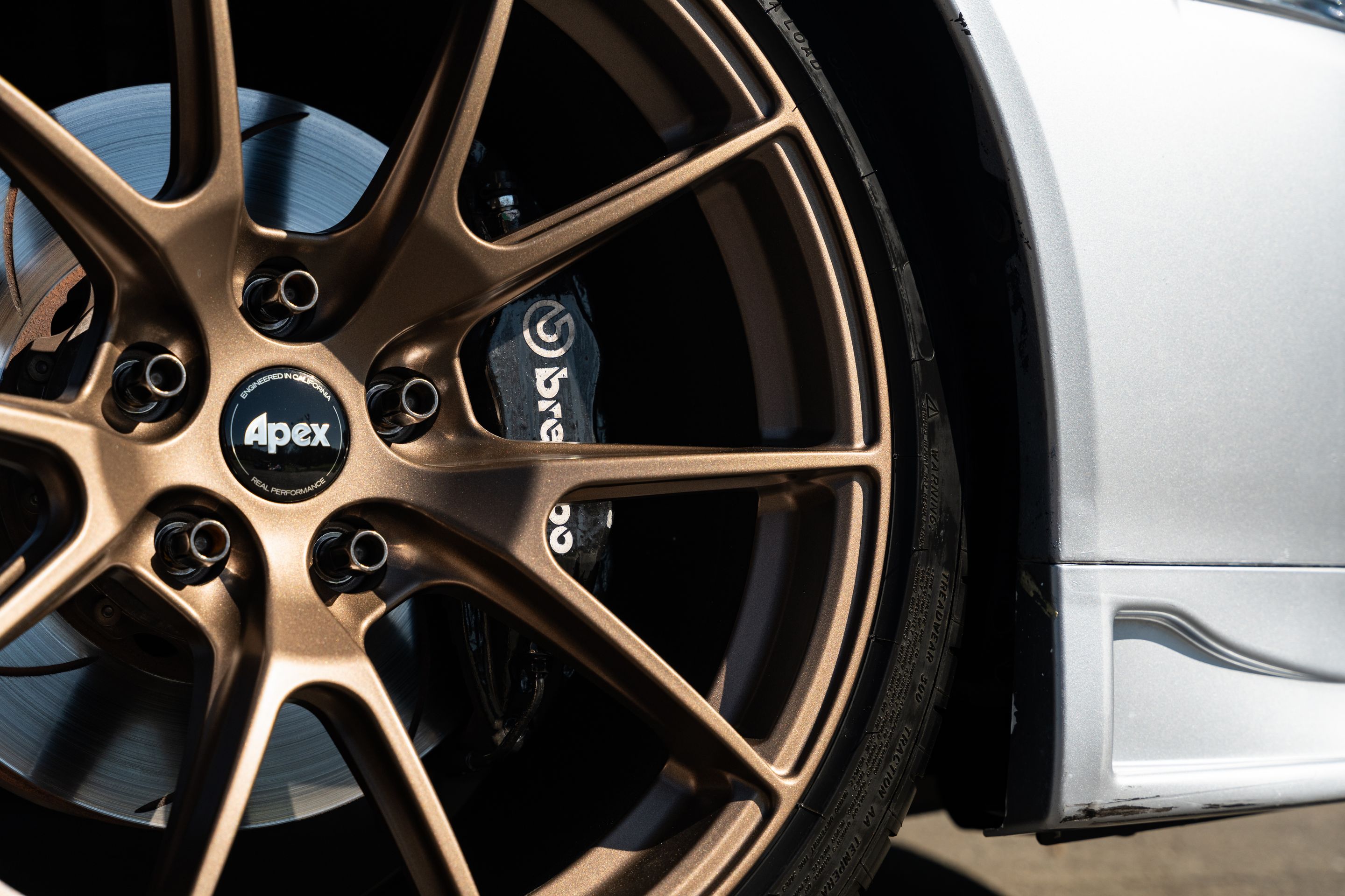 Silver Mitsubishi Lancer Evolution IX with 18" VS-5 Apex wheels in Satin Bronze