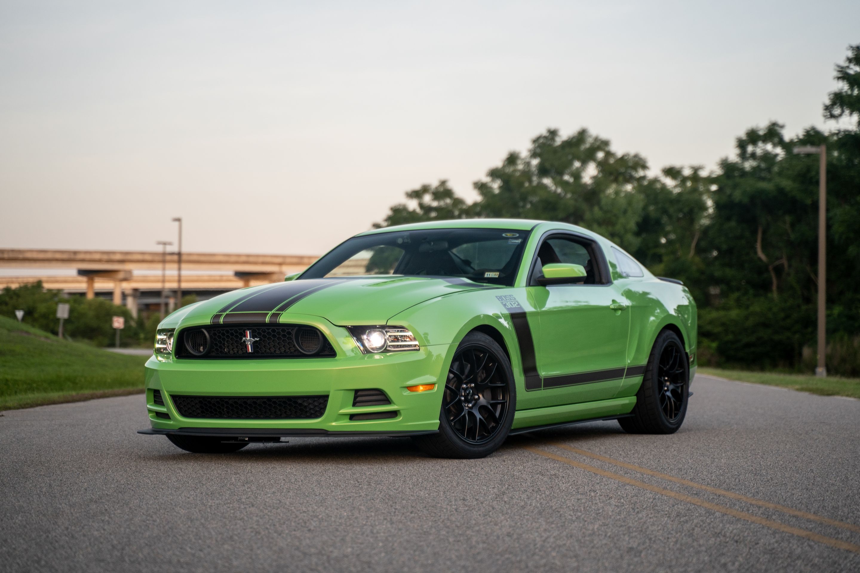 Green Ford S197 Mustang Boss 302 with 19" EC-7 Apex wheels in Satin Black