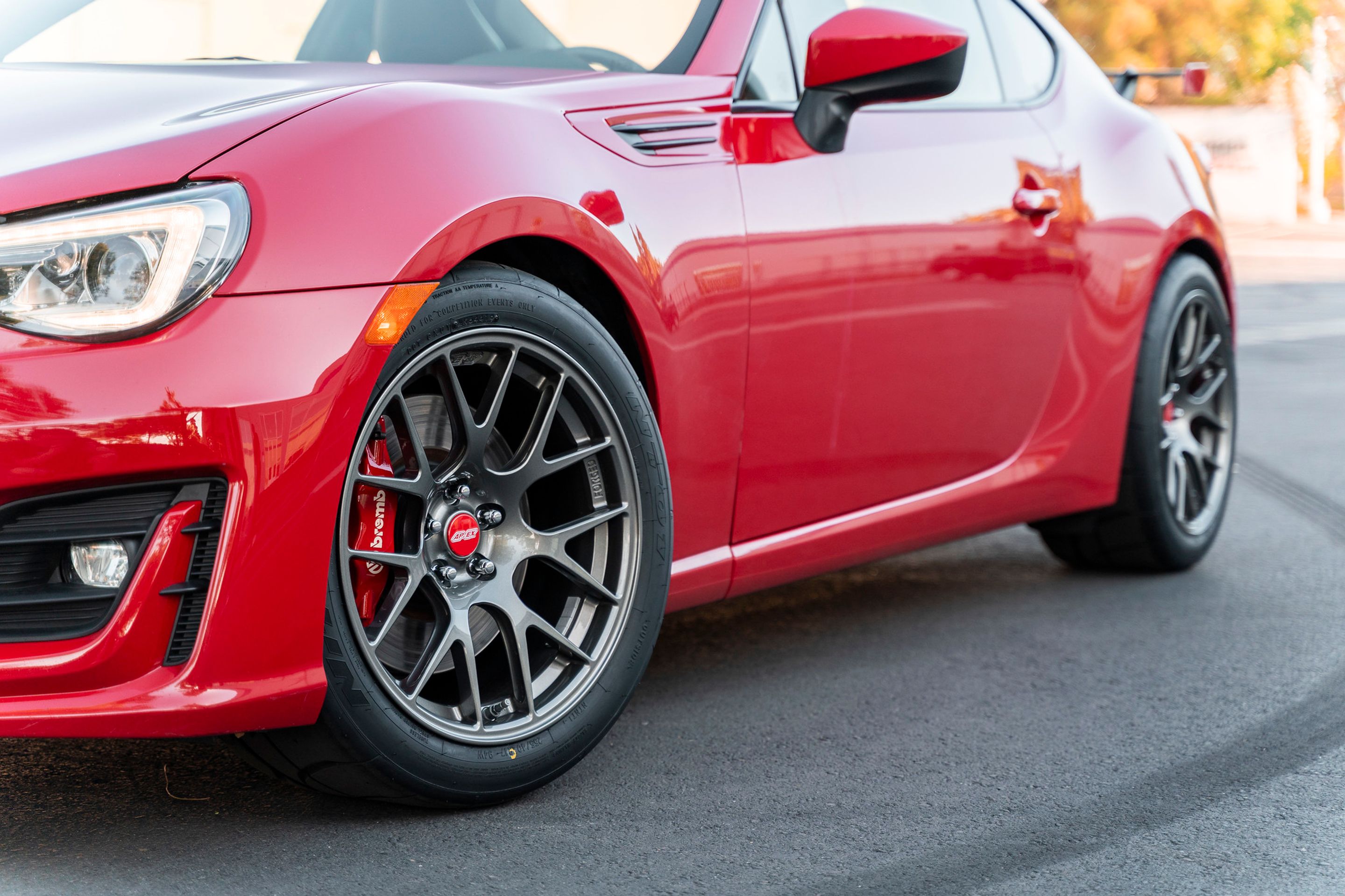 Red Subaru ZC6 / Gen 1 BRZ with 17" EC-7R Apex wheels in Anthracite