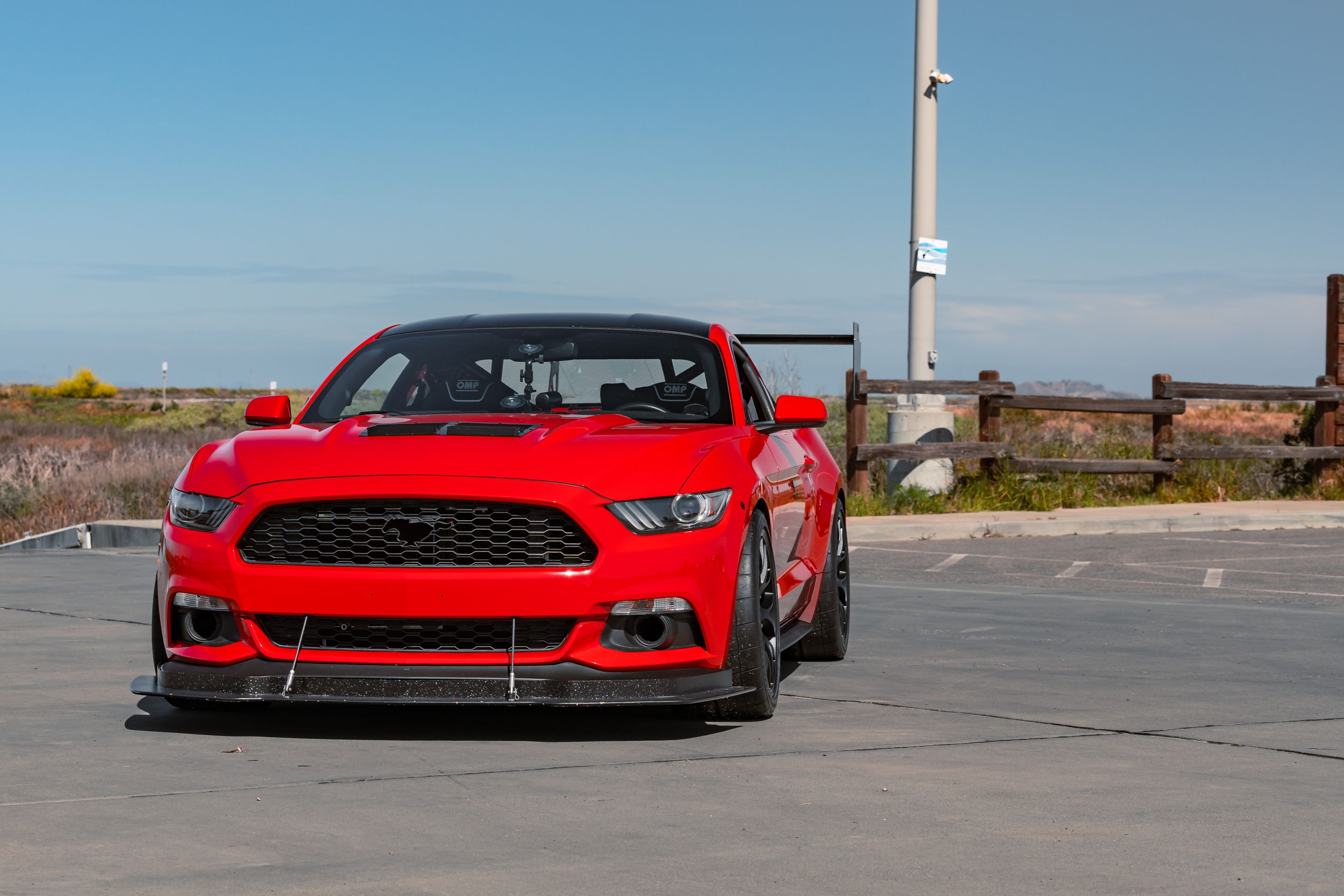 Red Ford S550 Mustang GT with 19" EC-7 Apex wheels in Satin Black