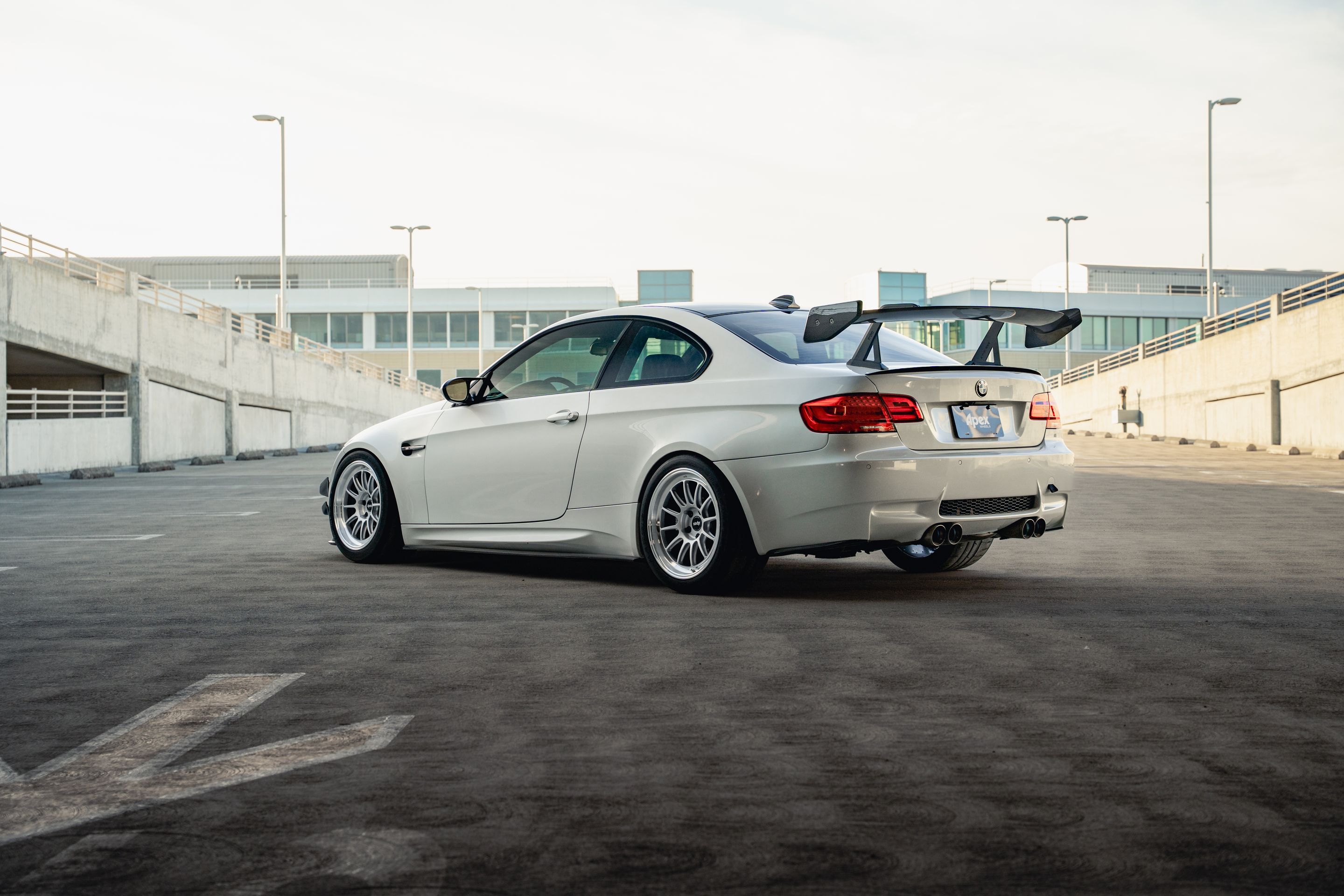 White BMW E92 Coupe M3 with 18" SL-12 Apex wheels in Machined Lip Race Silver