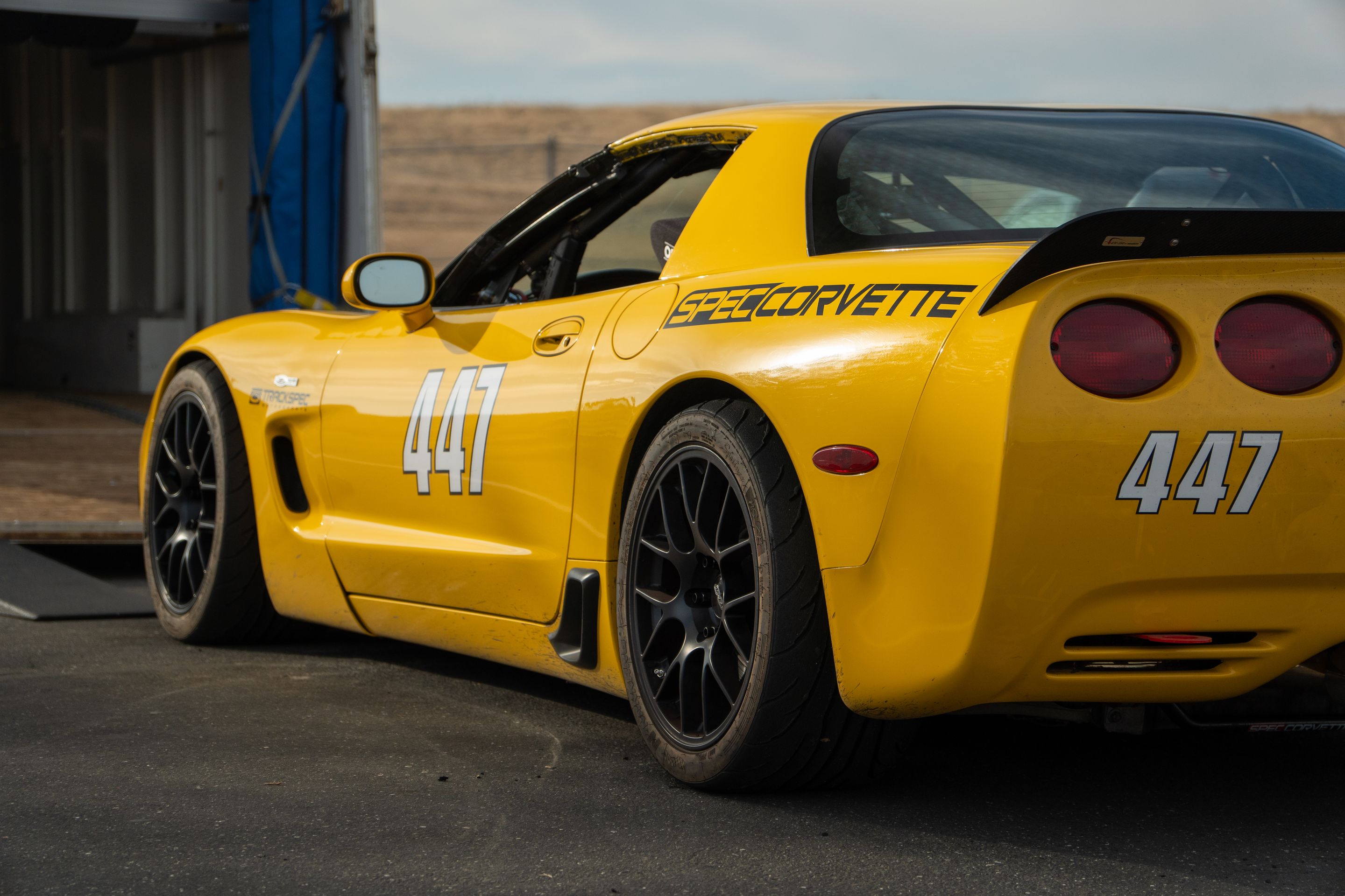 Yellow Chevrolet C5 Spec Corvette with 18" EC-7 Apex wheels in Satin Black