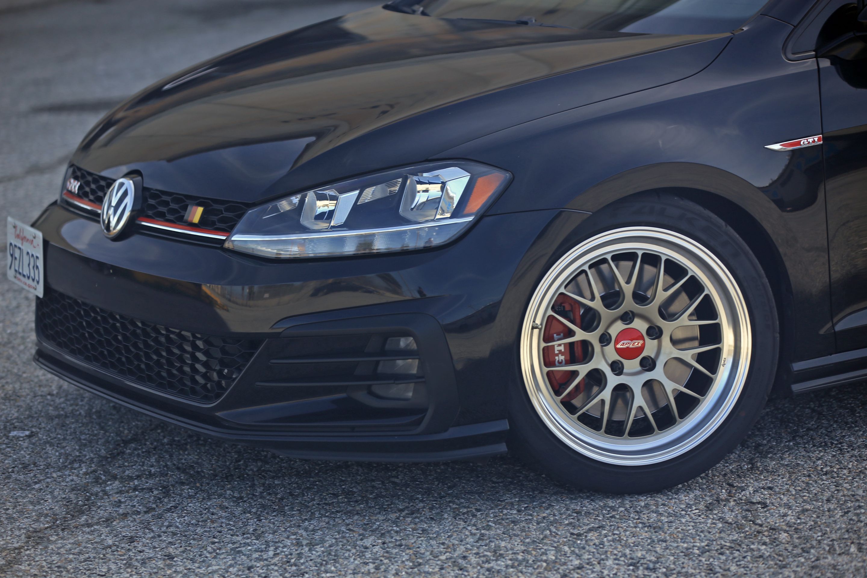 Black VW MK7 GTI with 18" ML-10RT Apex wheels in Machined Lip Gloss Motorsport Gold