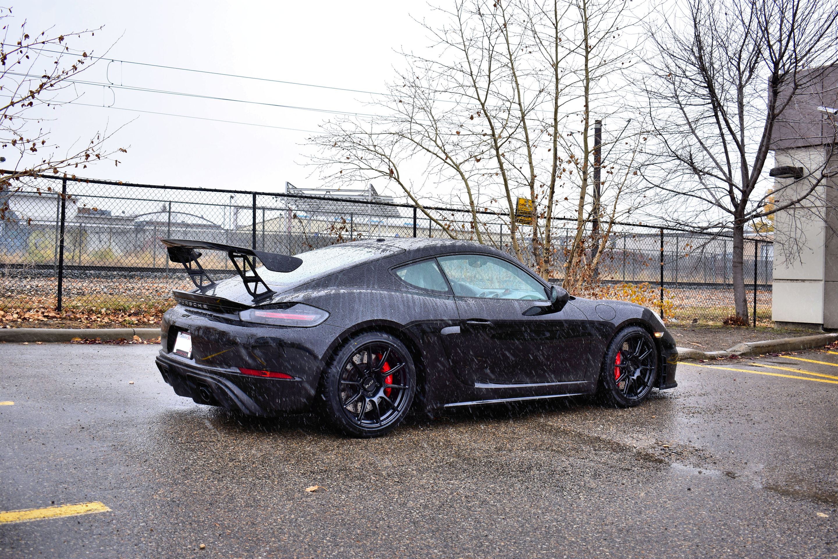 Black Porsche 718 Cayman GT4 with 19" SM-10 Apex wheels in Satin Black