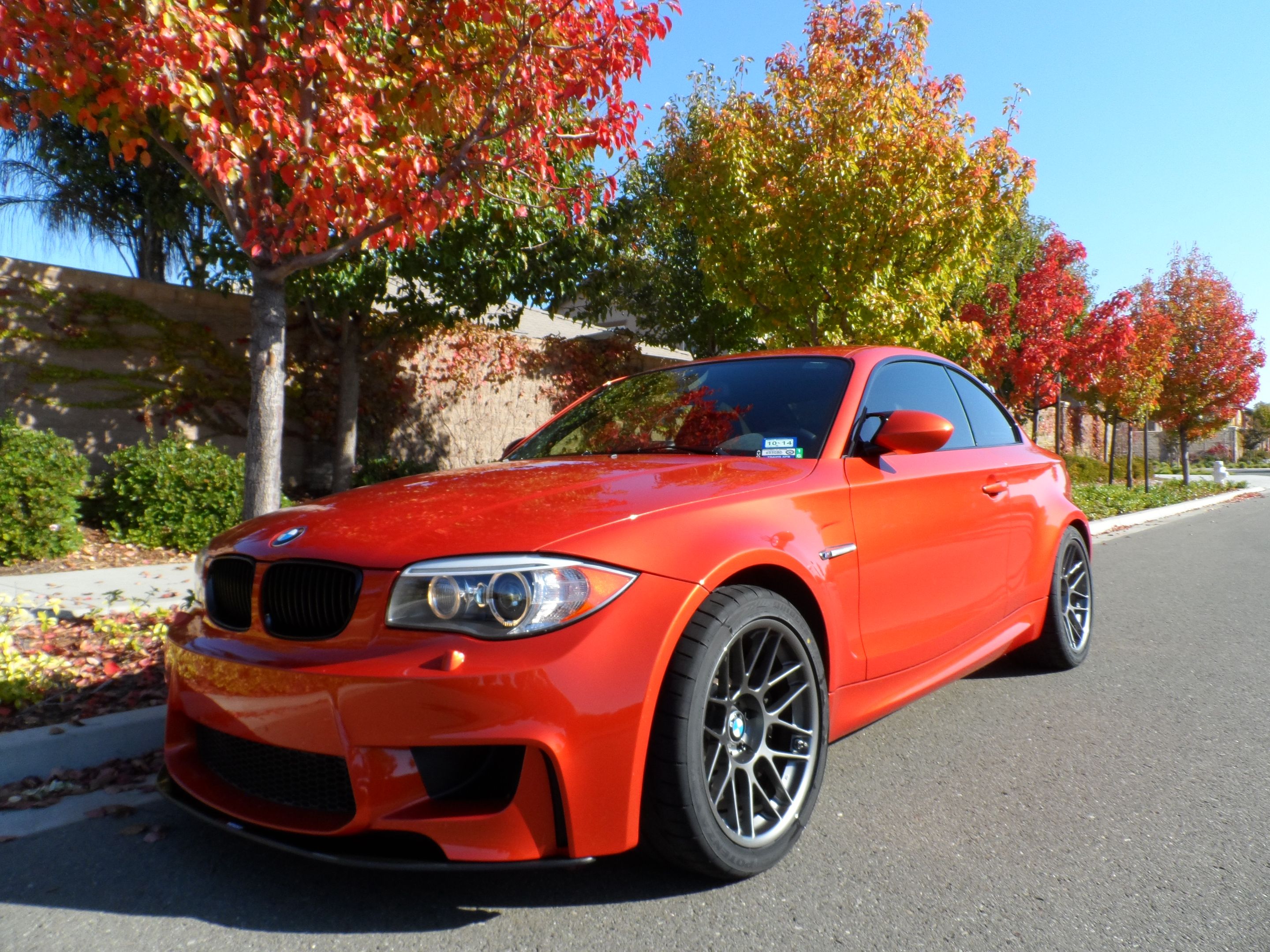 Orange BMW E82 1M with 18" ARC-8 Apex wheels in Satin Black