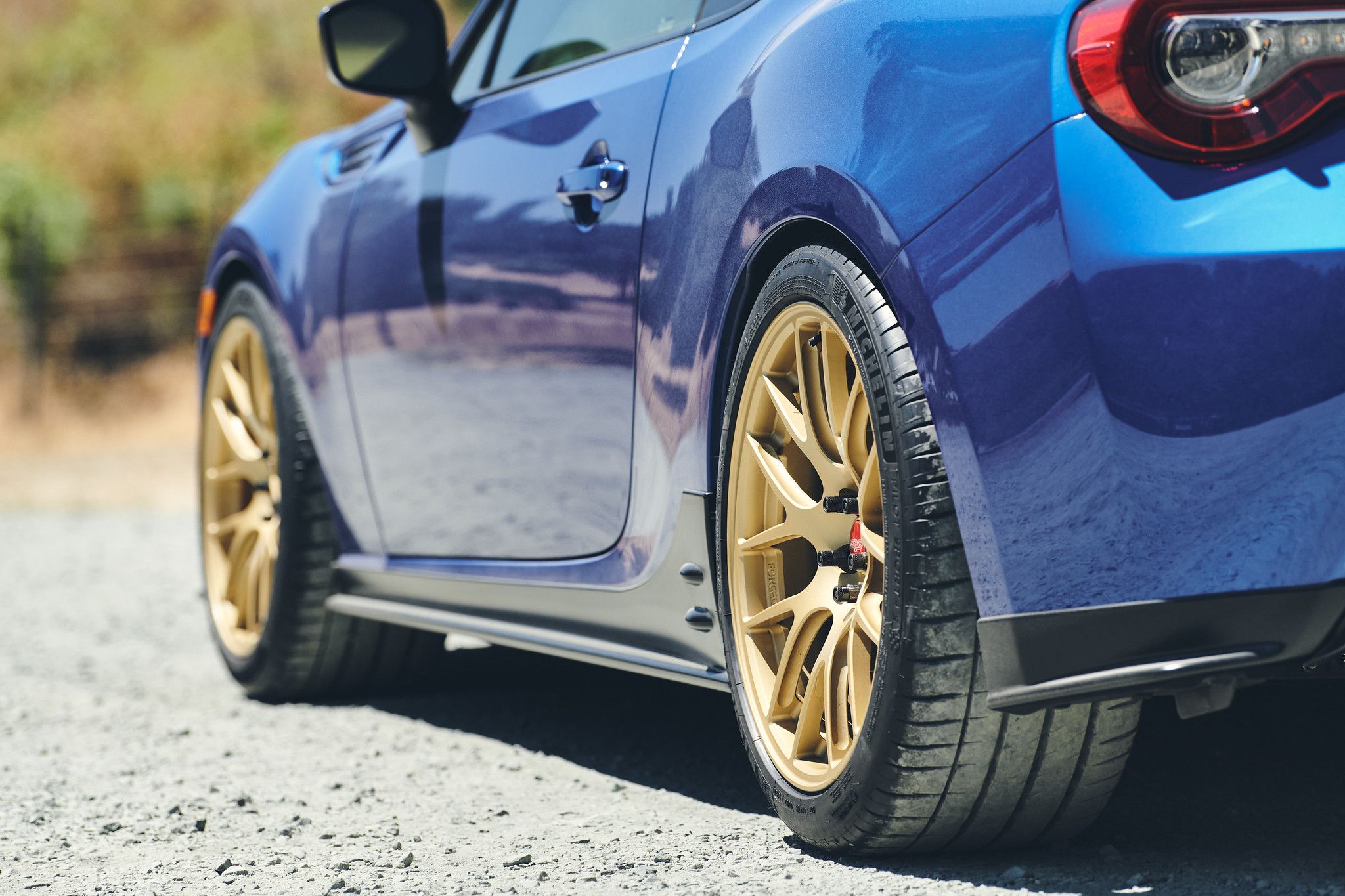 Blue Subaru ZC6 / Gen 1 BRZ with 17" EC-7R Apex wheels in Satin Gold