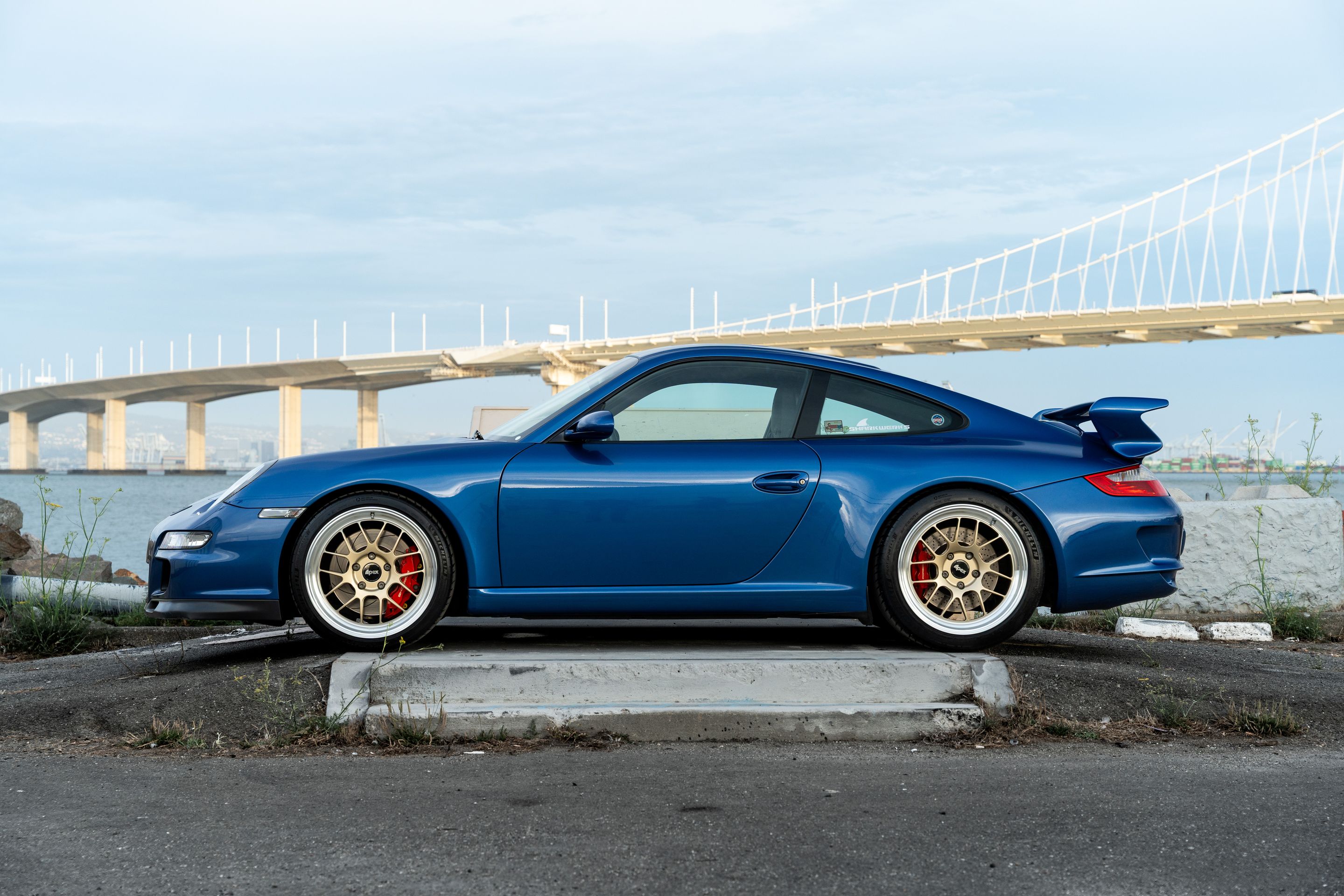 Blue Porsche 911 997 GT3 with 19" TEST-M Apex wheels in Machined Lip Gloss Motorsport Gold