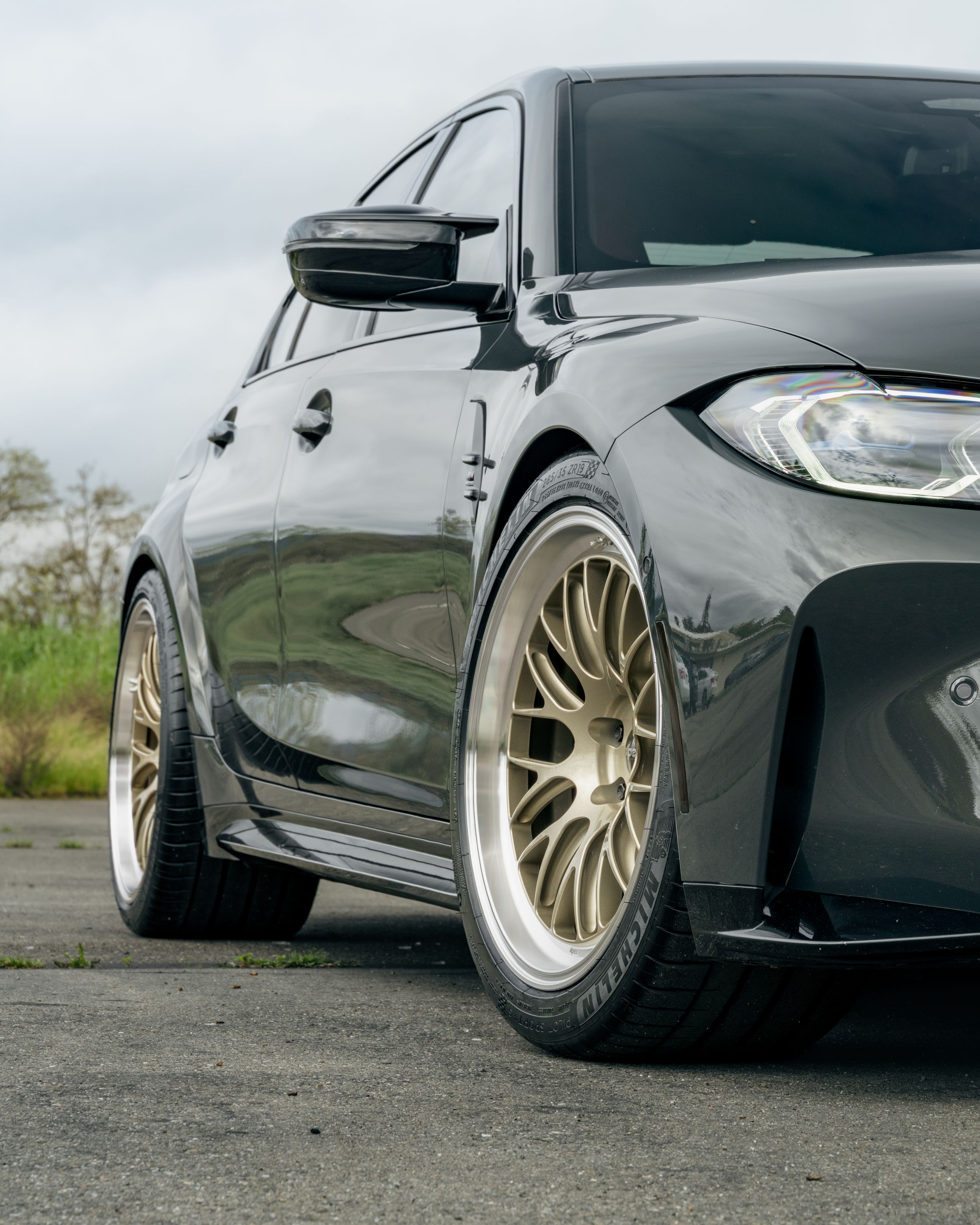 Grey BMW G80 M3 with 19"/20" ML-10RT Apex wheels in Machined Lip Gloss Motorsport Gold