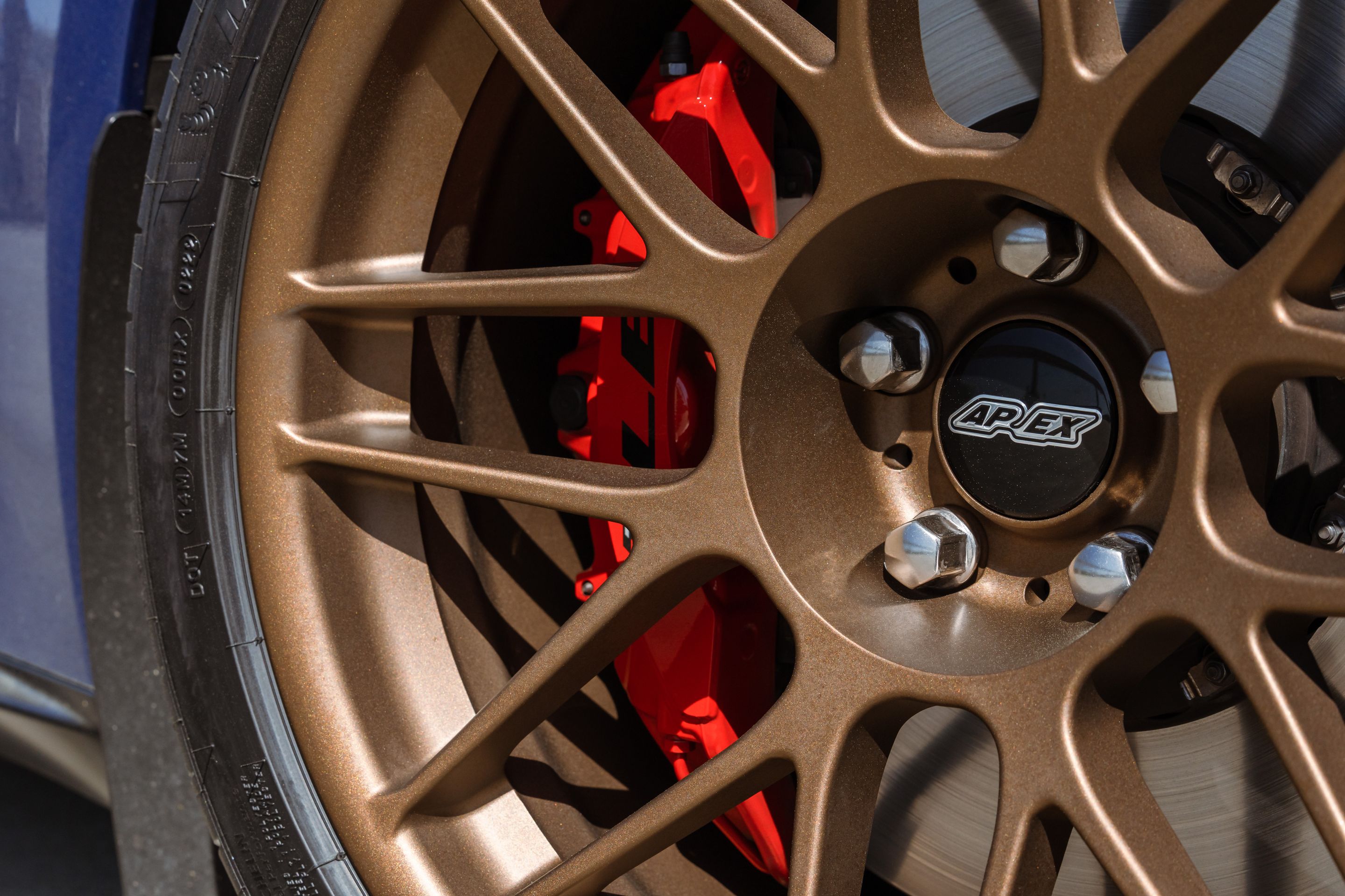 Blue Chevrolet 6th Gen Camaro ZL1 1LE with 19" ARC-8 Apex wheels in Satin Bronze