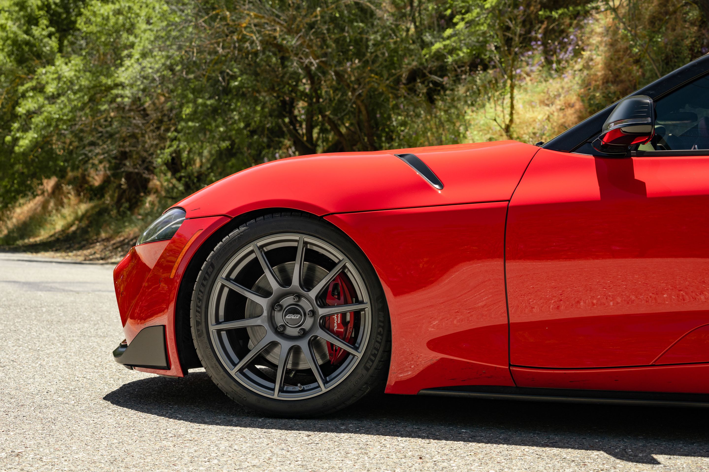 Red Toyota GR Supra with 19" SM-10 Apex wheels in Anthracite