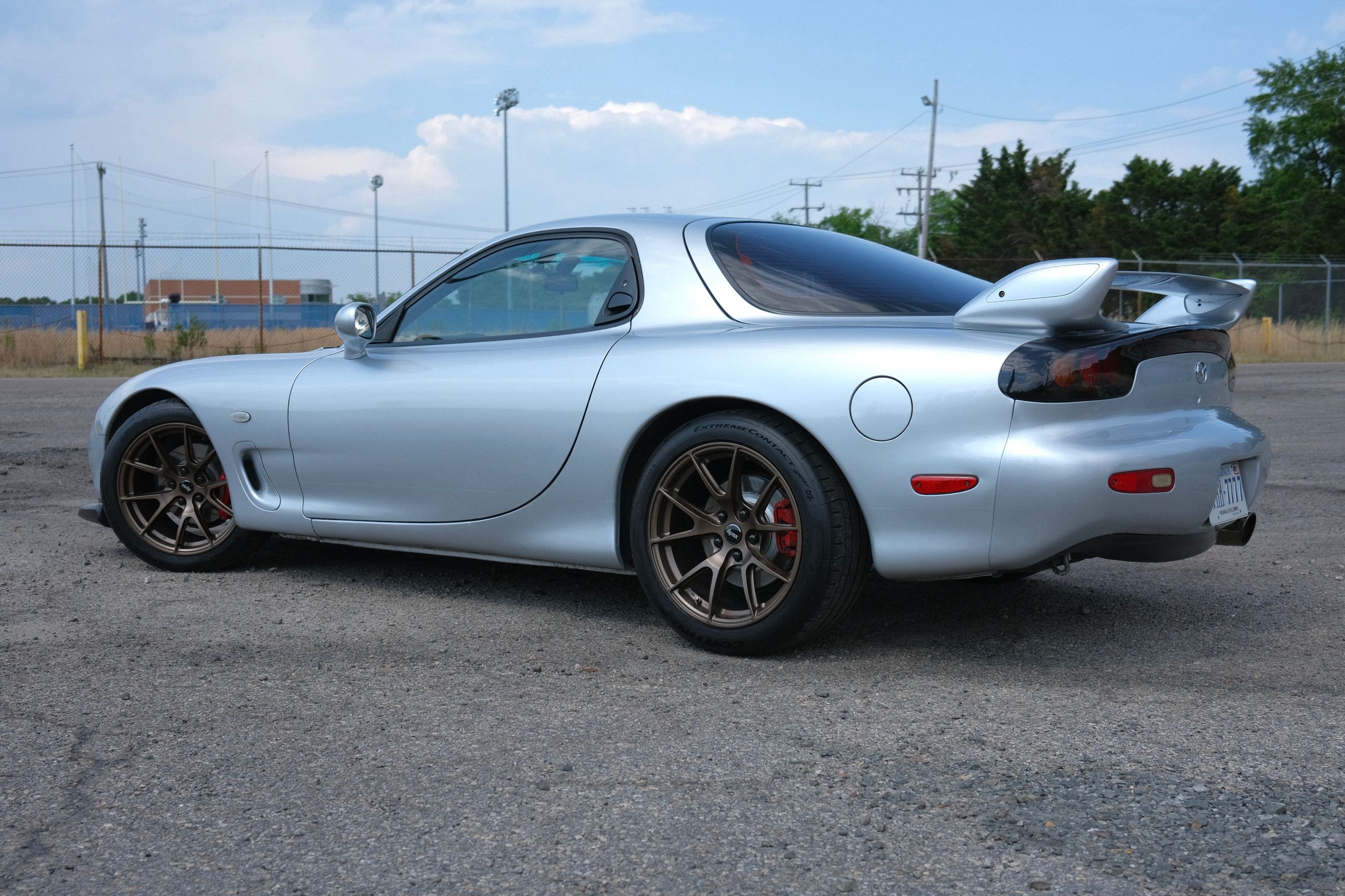 Silver Mazda FD RX-7 with 17" VS-5 Apex wheels in Satin Bronze