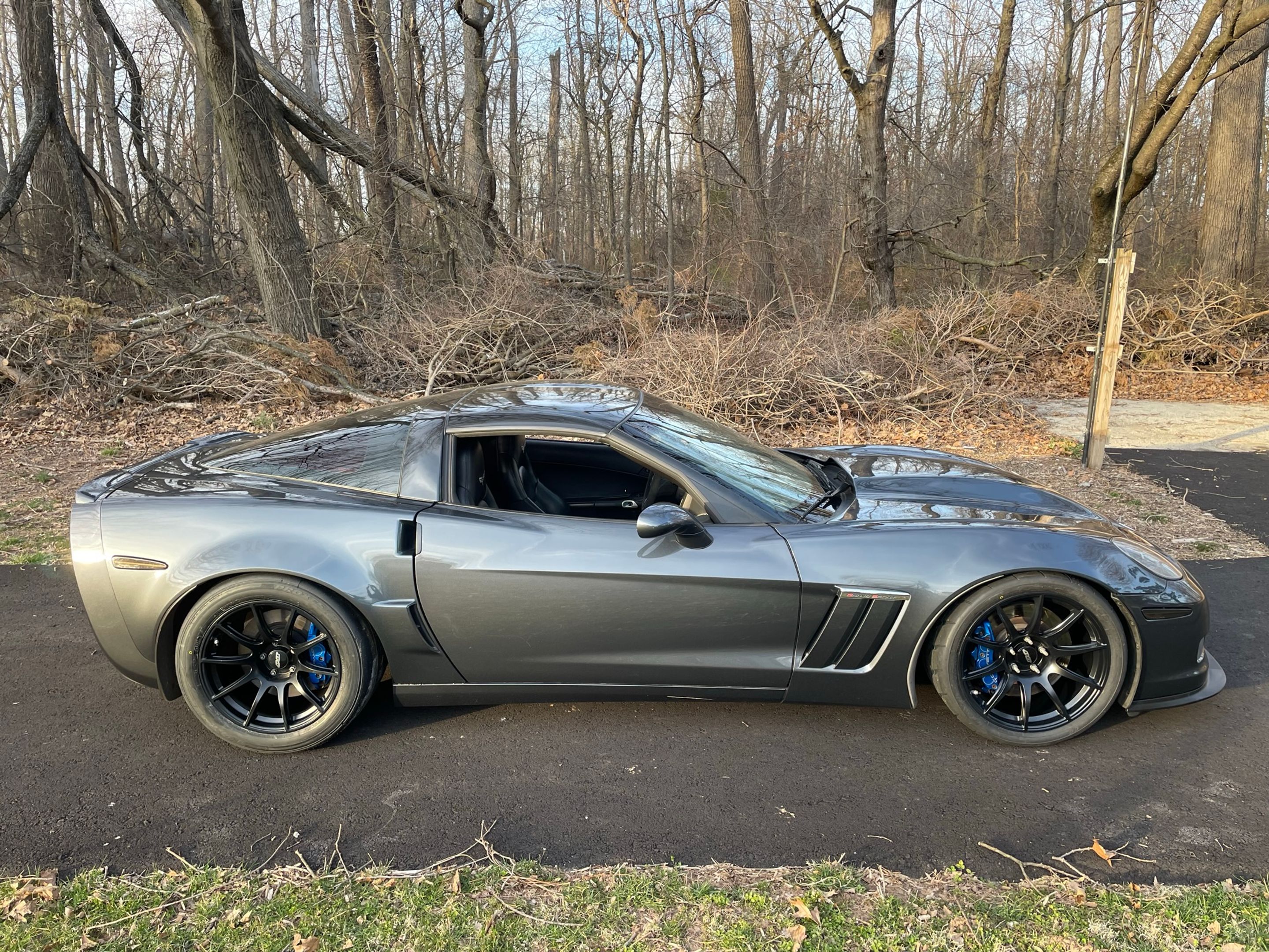 Grey Chevrolet C6 Corvette Grand Sport with 19"/18" SM-10 Apex wheels in Satin Black