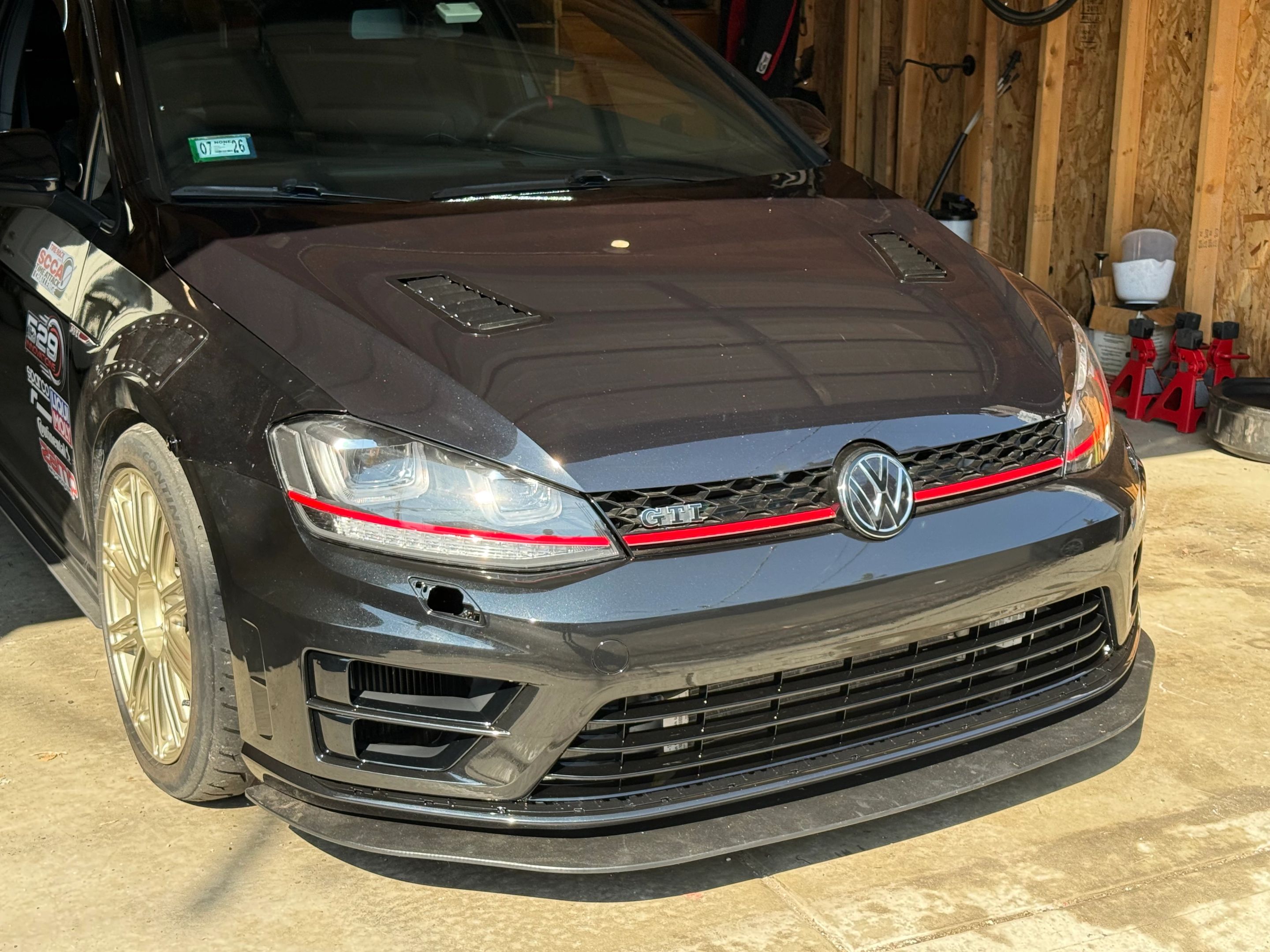 Black VW MK7 GTI with 18" TC-10RT Apex wheels in Motorsport Gold