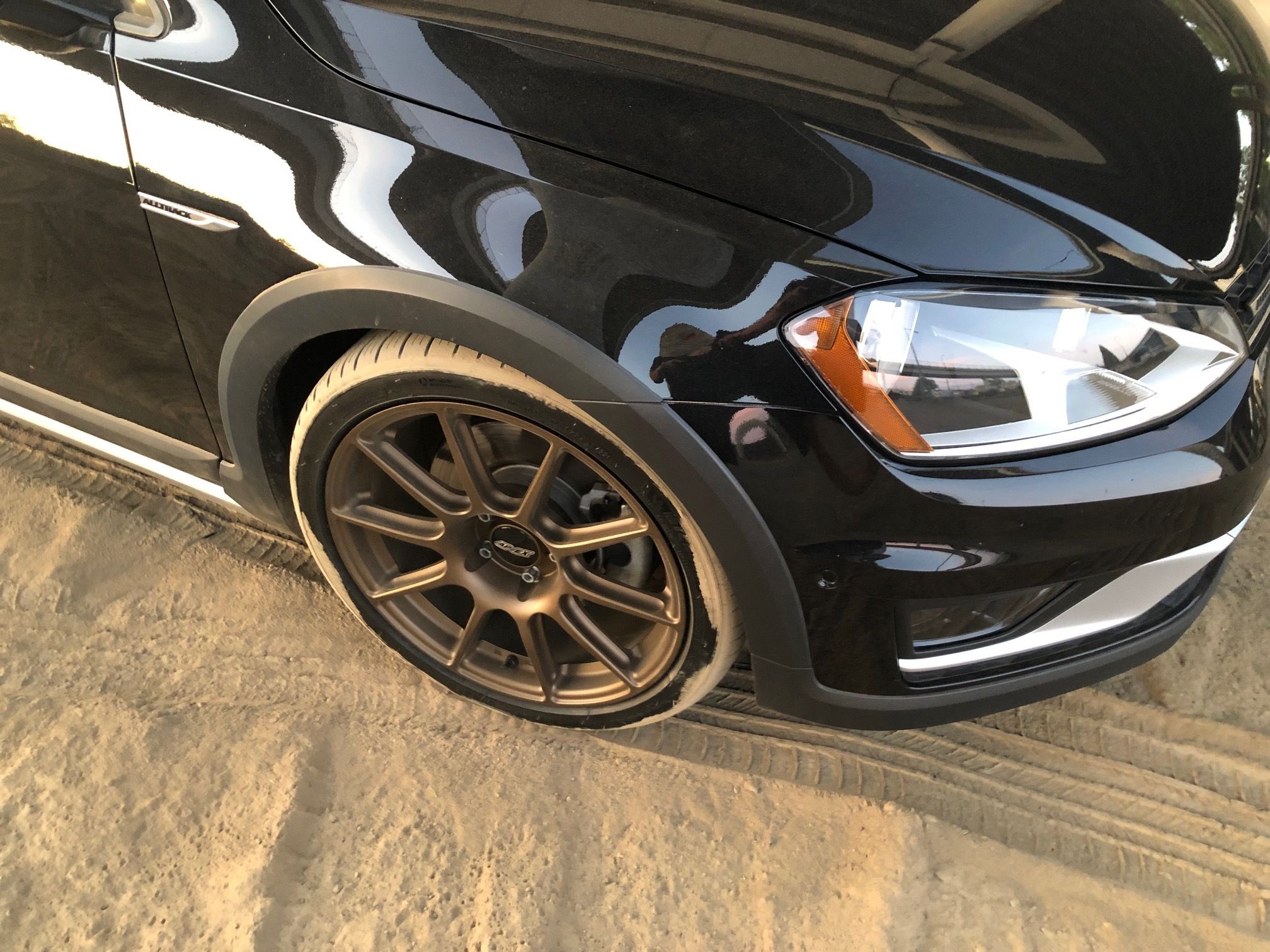 Black VW MK7 Alltrack/SportWagen Alltrack with 18" SM-10 Apex wheels in Satin Bronze