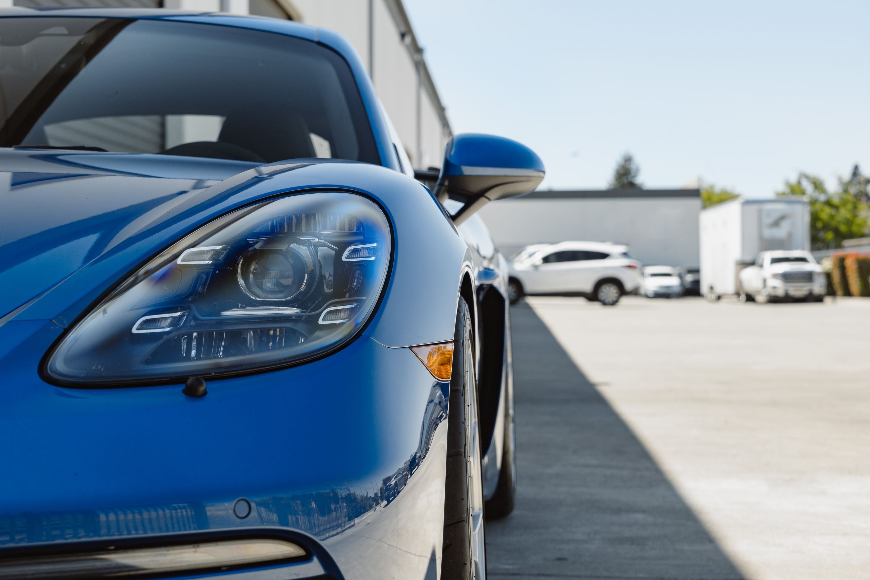 Blue Porsche 718 Cayman GTS 2.5L with 19" VS-5RS Apex wheels in Brushed Clear
