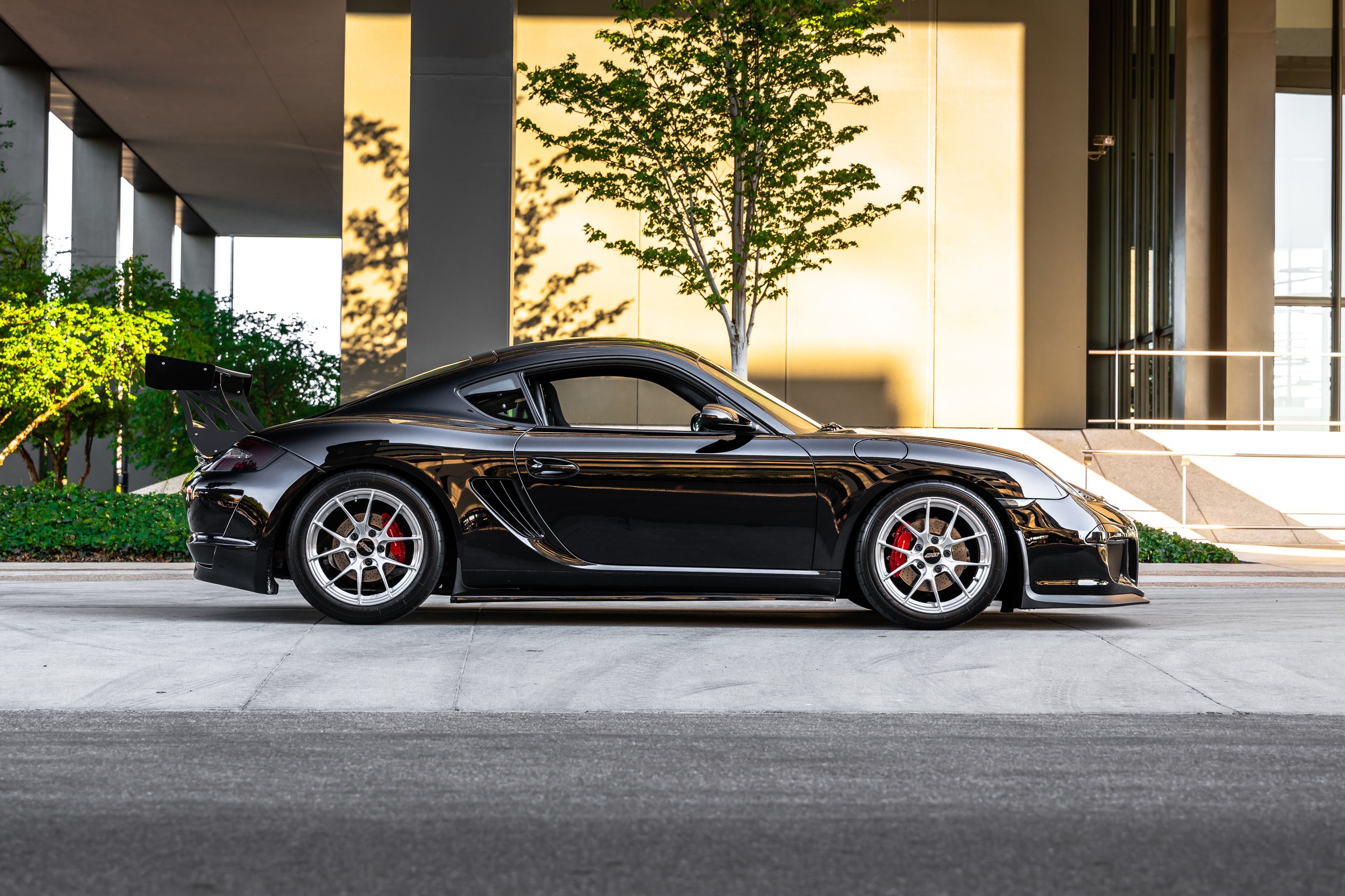 Black Porsche 987 Cayman S with 18" VS-5RS Apex wheels in Brushed Clear