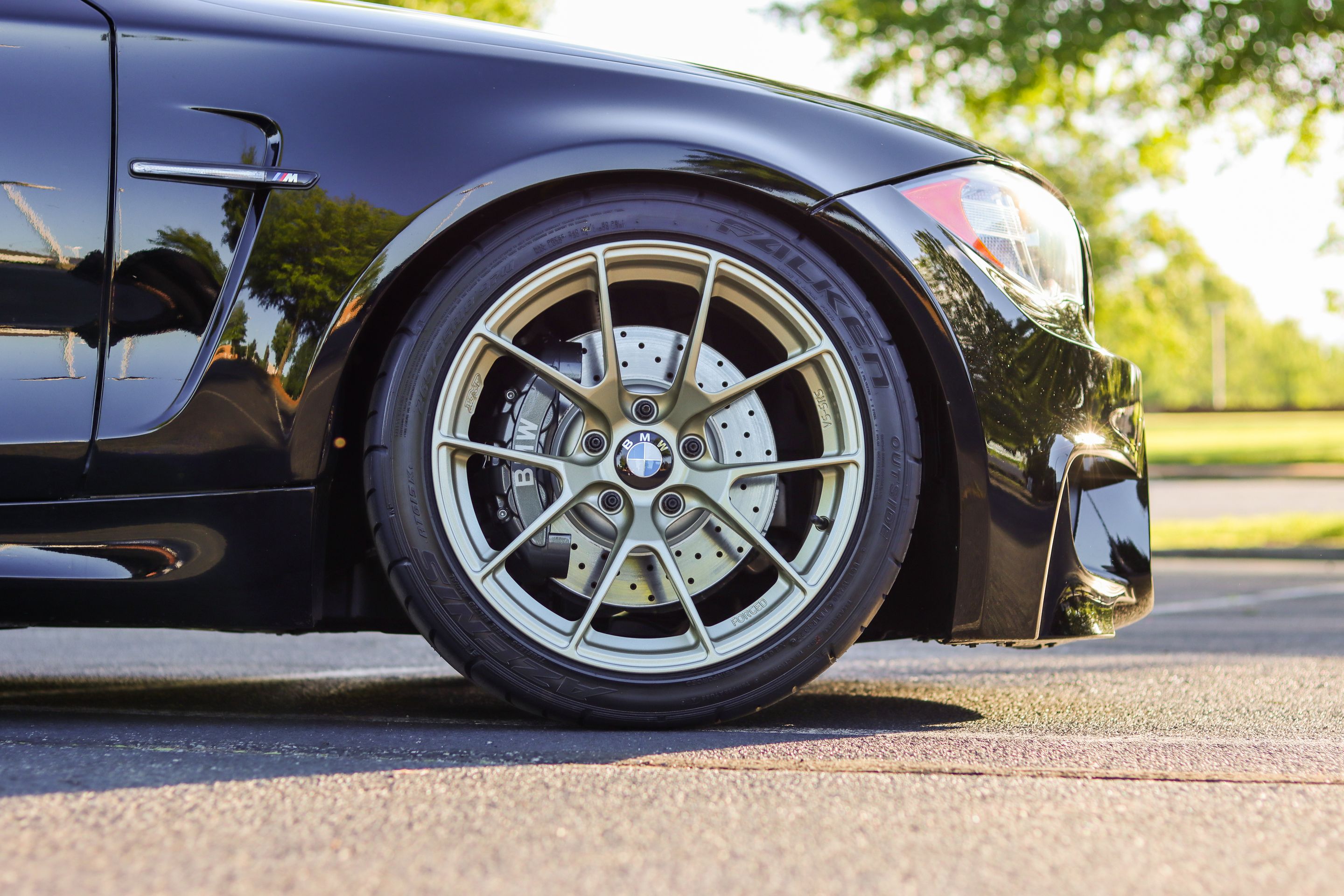 Black BMW E82 Coupe 1 Series with 18" VS-5RS Apex wheels in Motorsport Gold