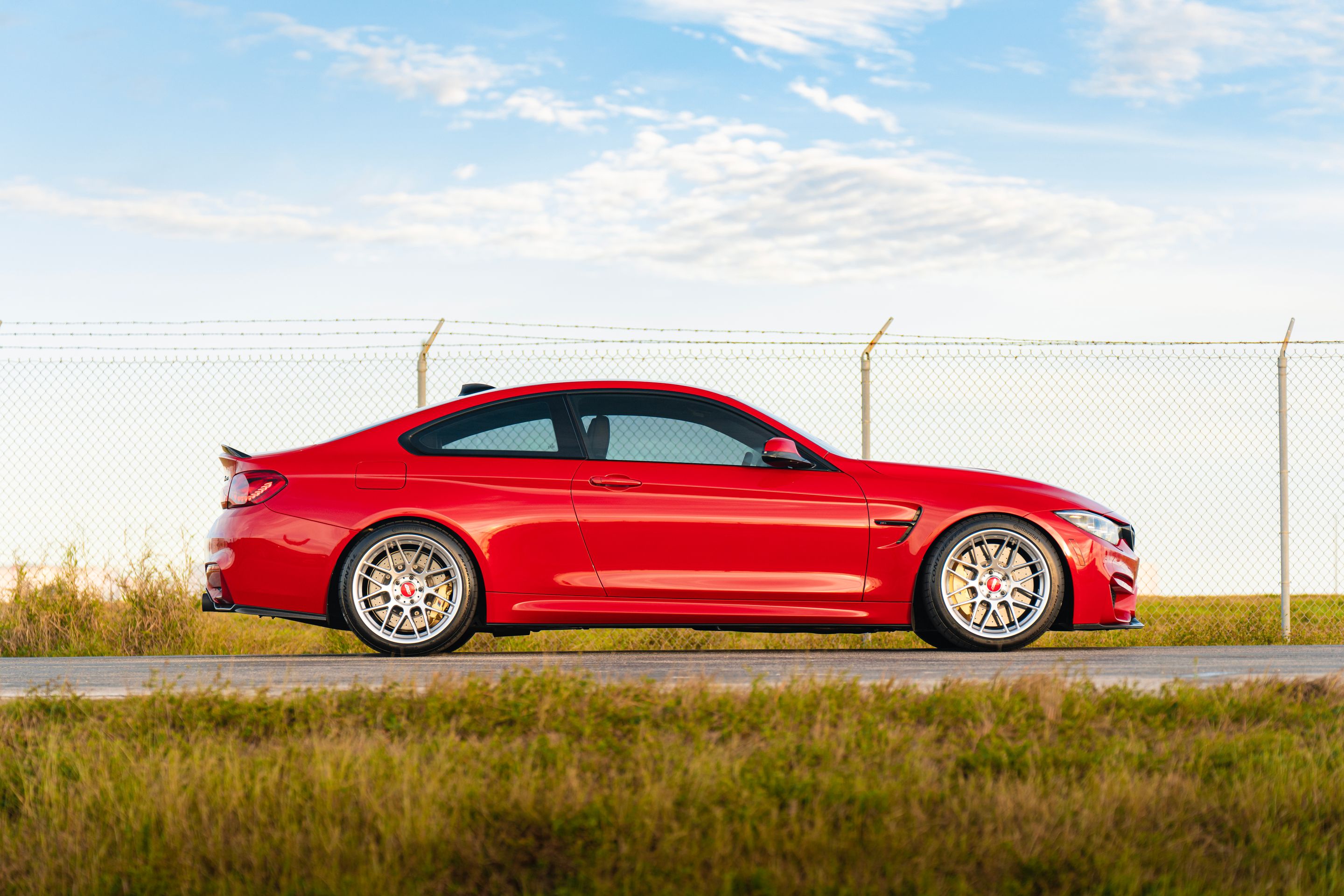 Red BMW F82 Coupe M4 with 19" ARC-8 Apex wheels in Hyper Silver