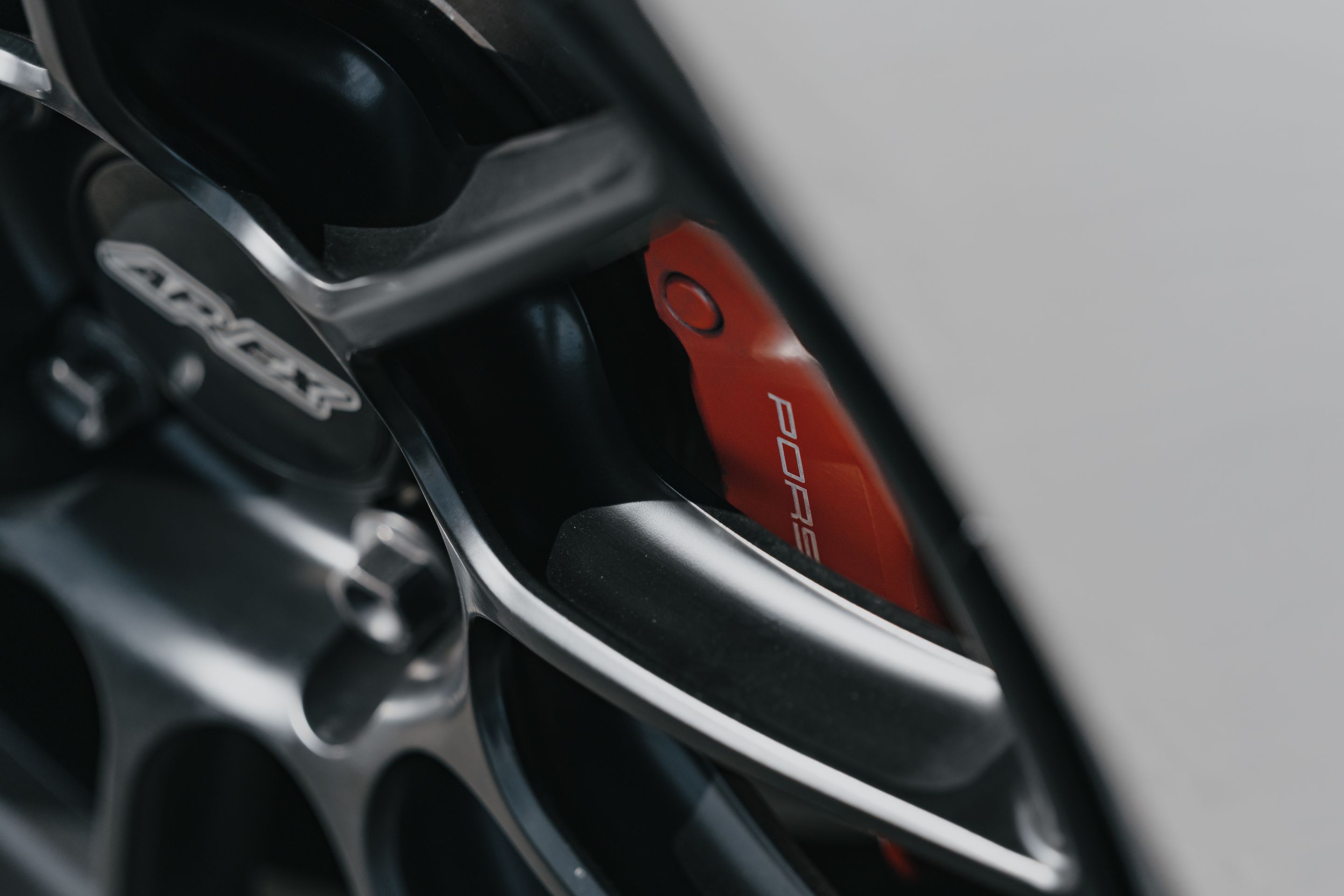 Silver Porsche 987 Cayman R with 18" SM-10RS Apex wheels in Satin Black