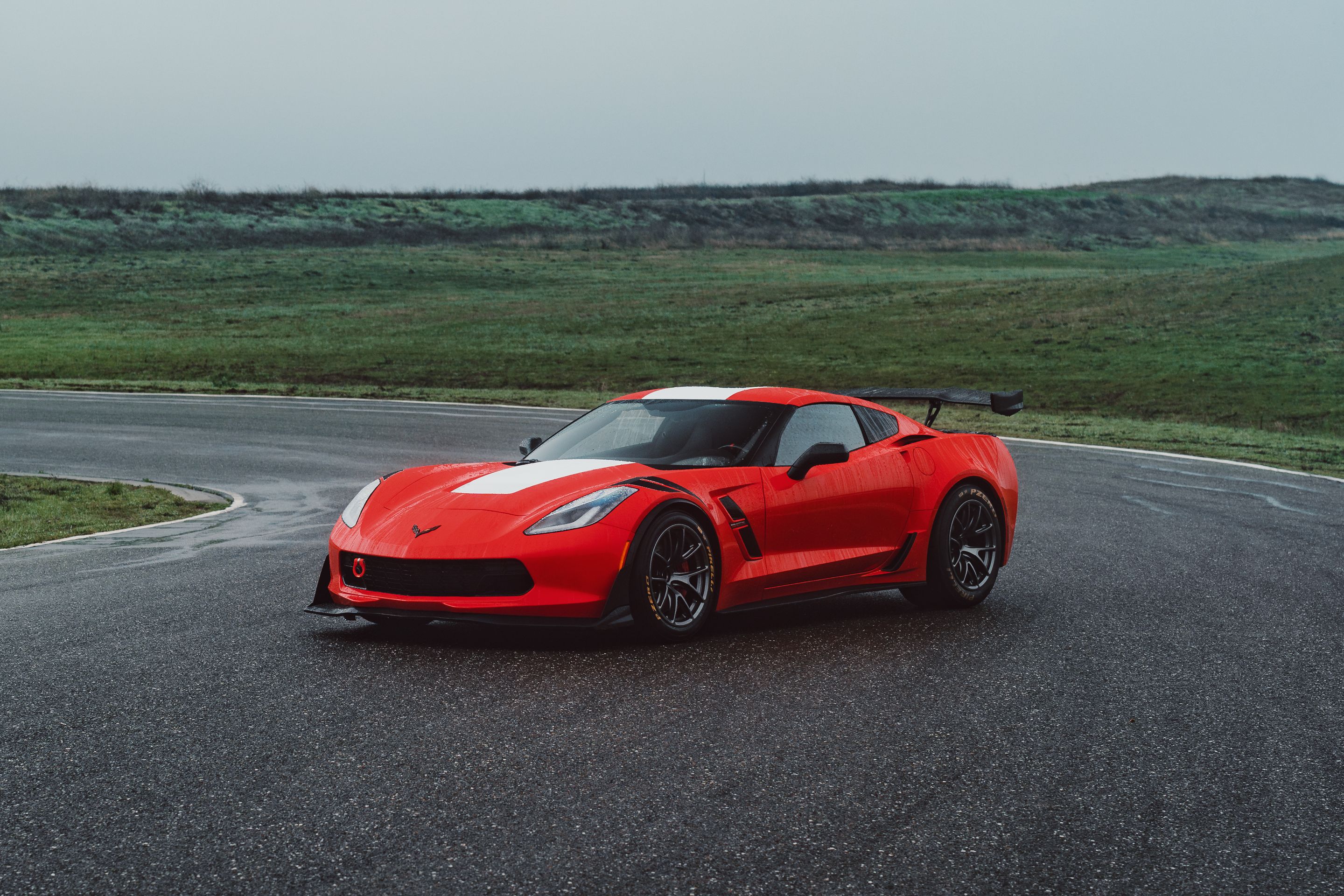 Red Chevrolet C7 Corvette Grand Sport with 18" VS-5RE Apex wheels in Anthracite