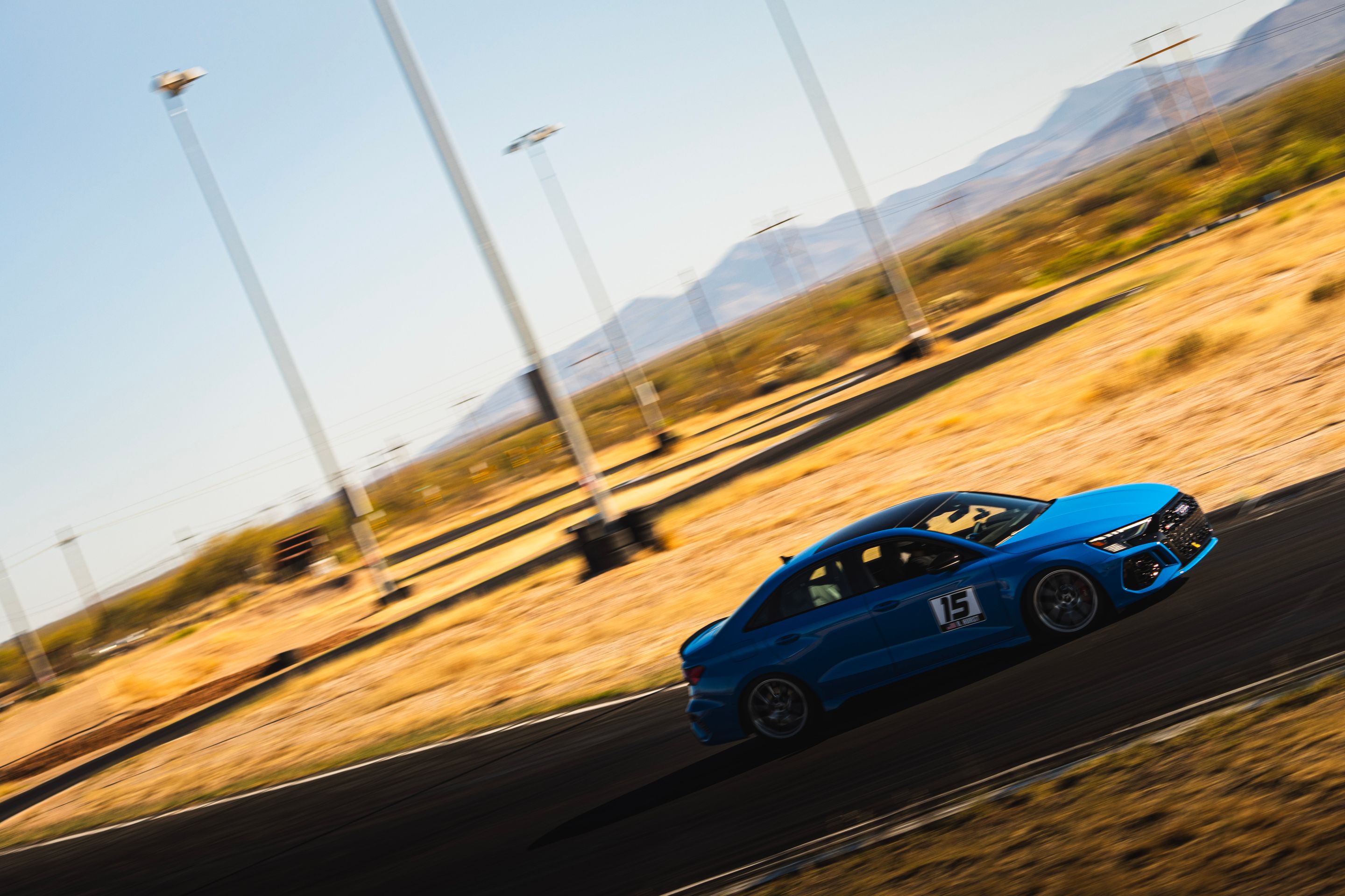 Blue Audi 8Y RS 3 with 18" VS-5RS Apex wheels in Brushed Clear