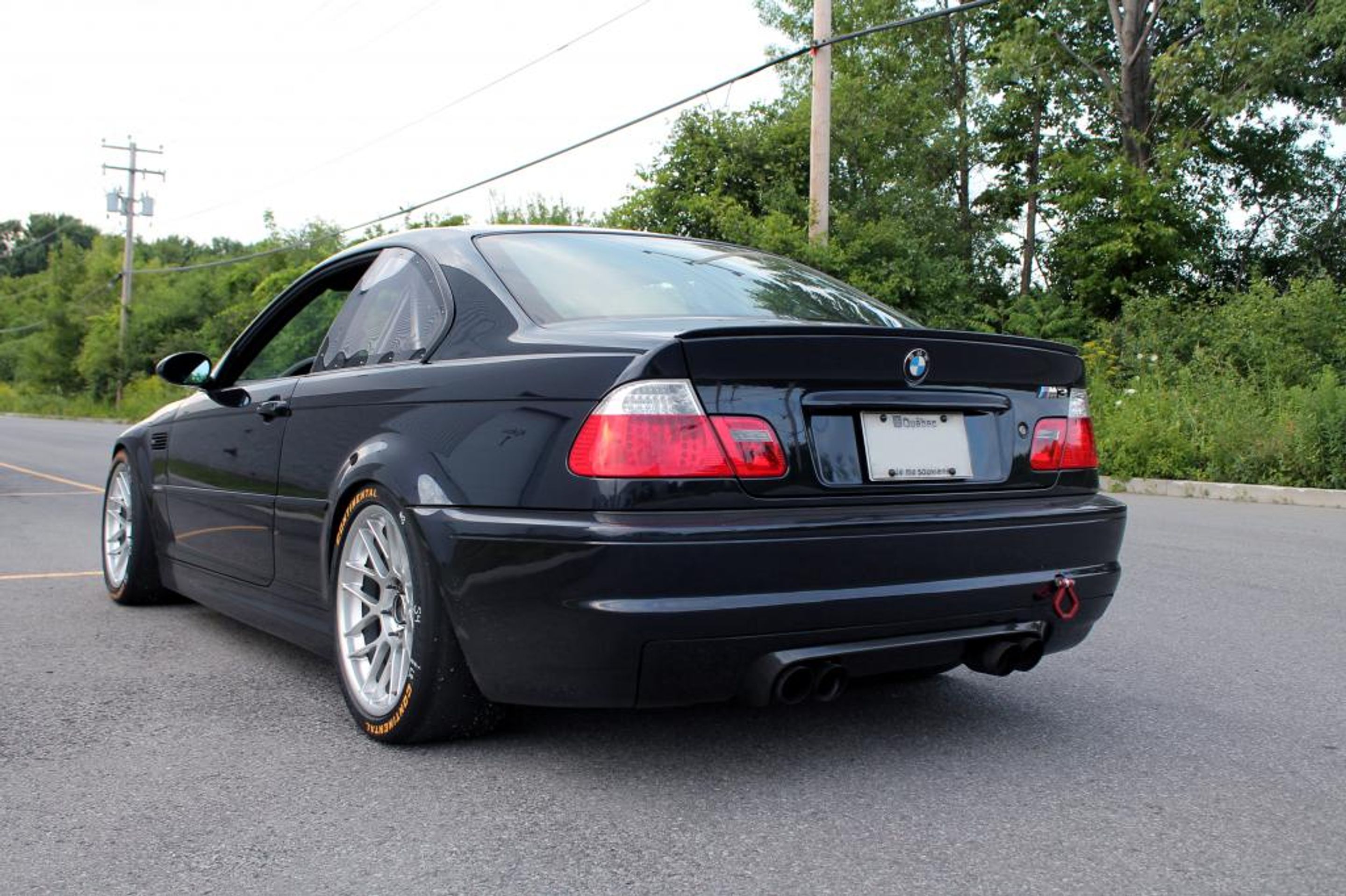 Black BMW E46 M3 with 18" ARC-8 Apex wheels in Hyper Silver