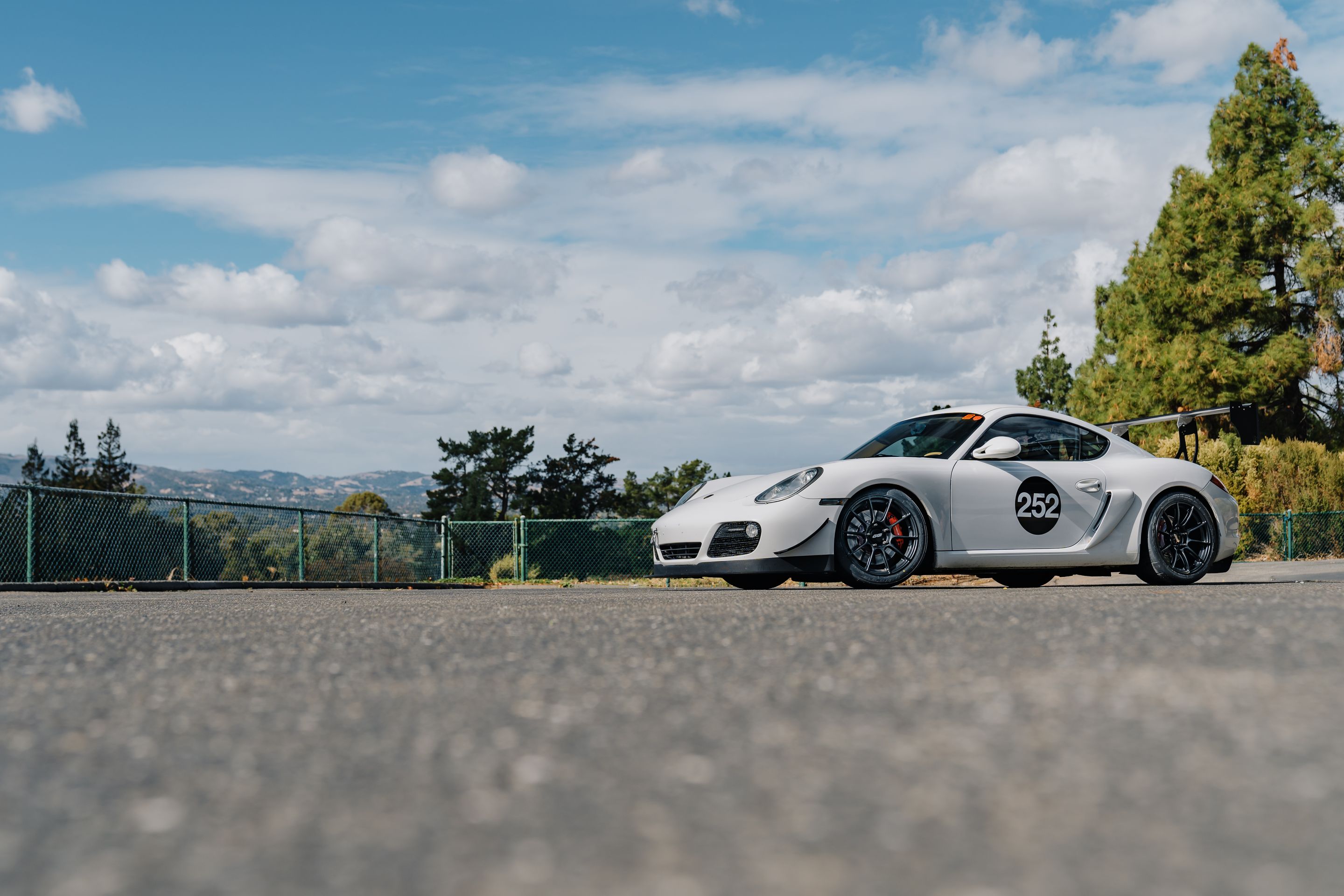 White Porsche 987 Cayman S with 18" SM-10RS Apex wheels in Satin Black