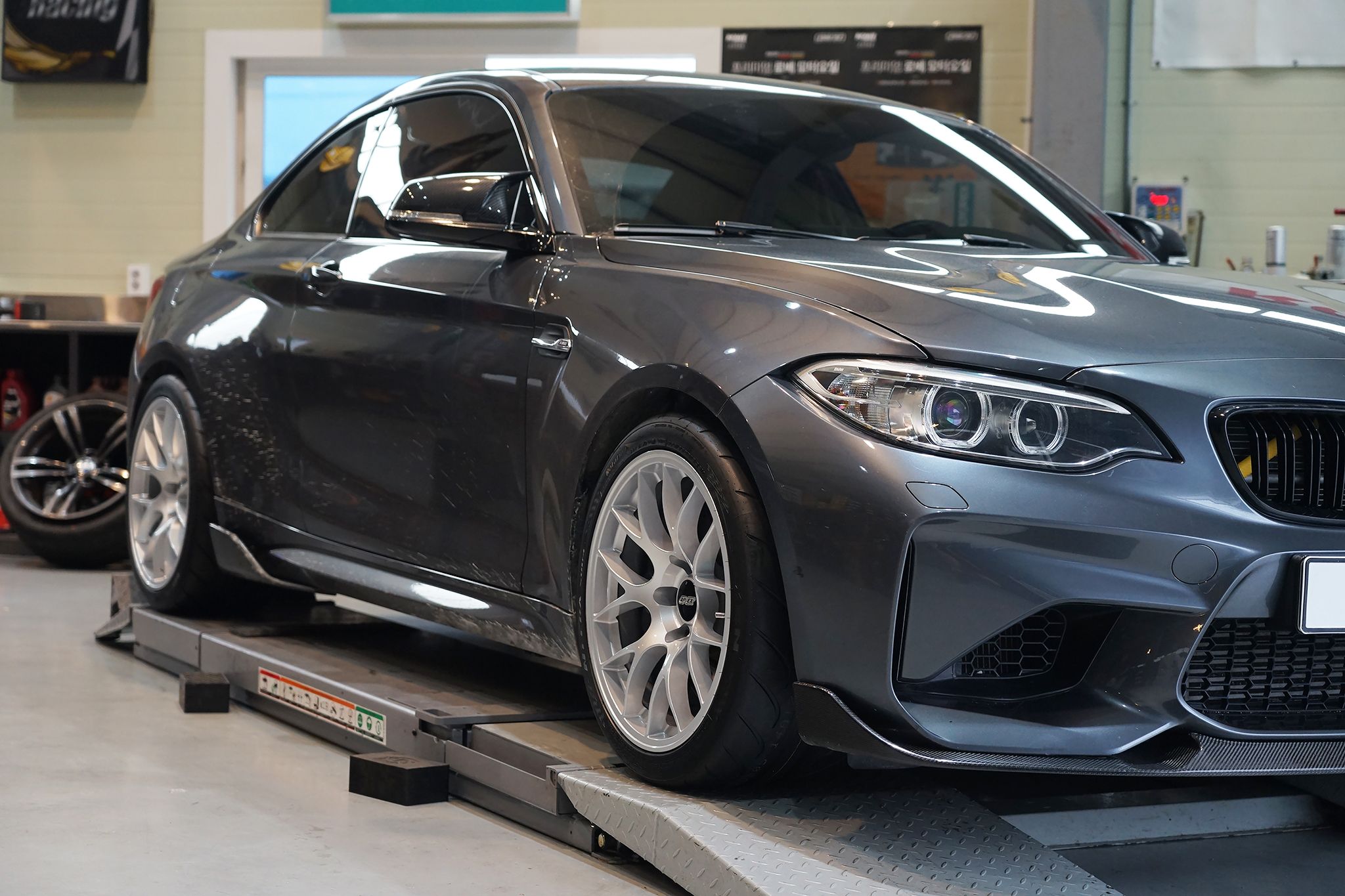 Grey BMW F87 M2 with 18" EC-7 Apex wheels in Race Silver