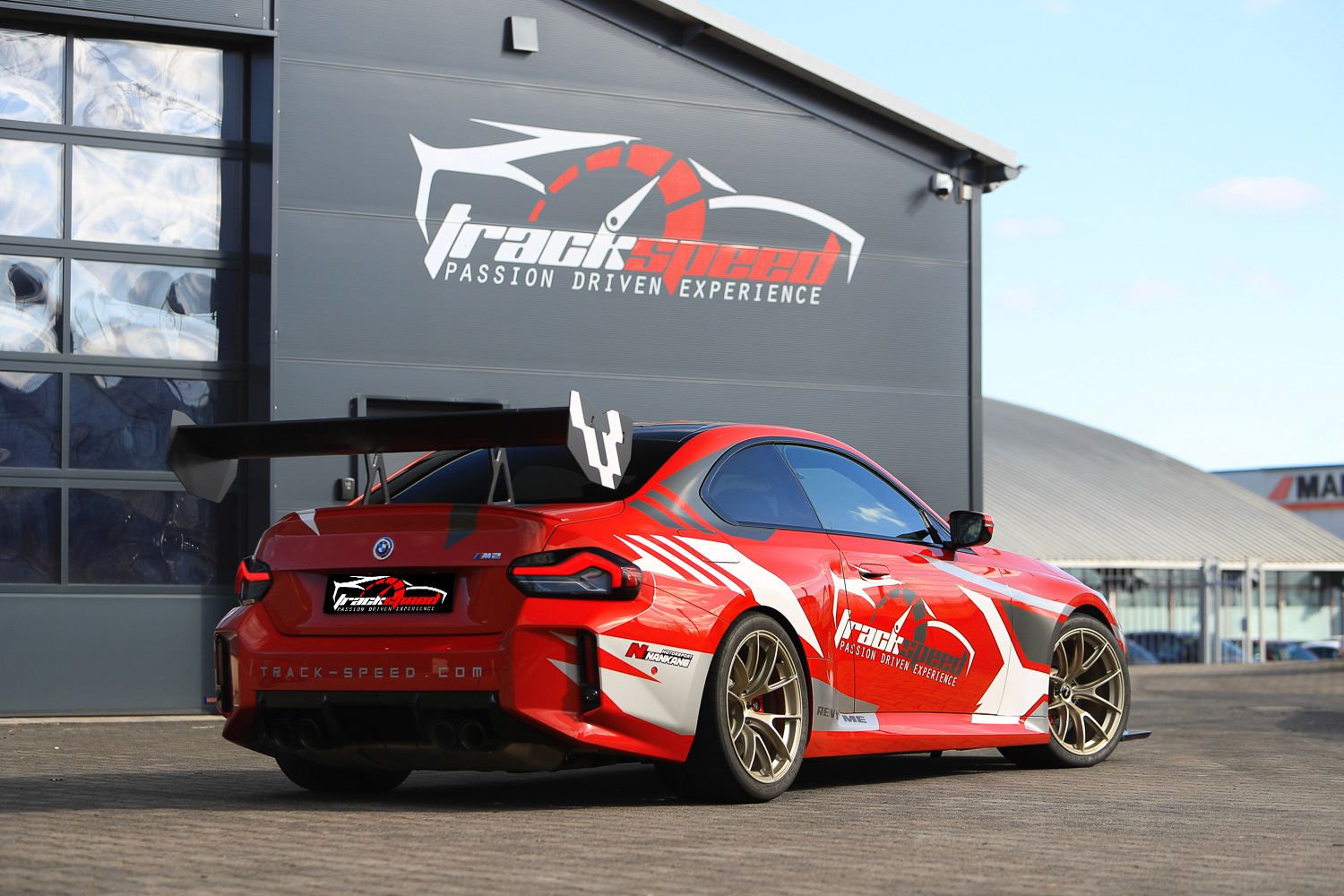 Red BMW G87 M2 with 19" VS-5RS Apex wheels in Motorsport Gold