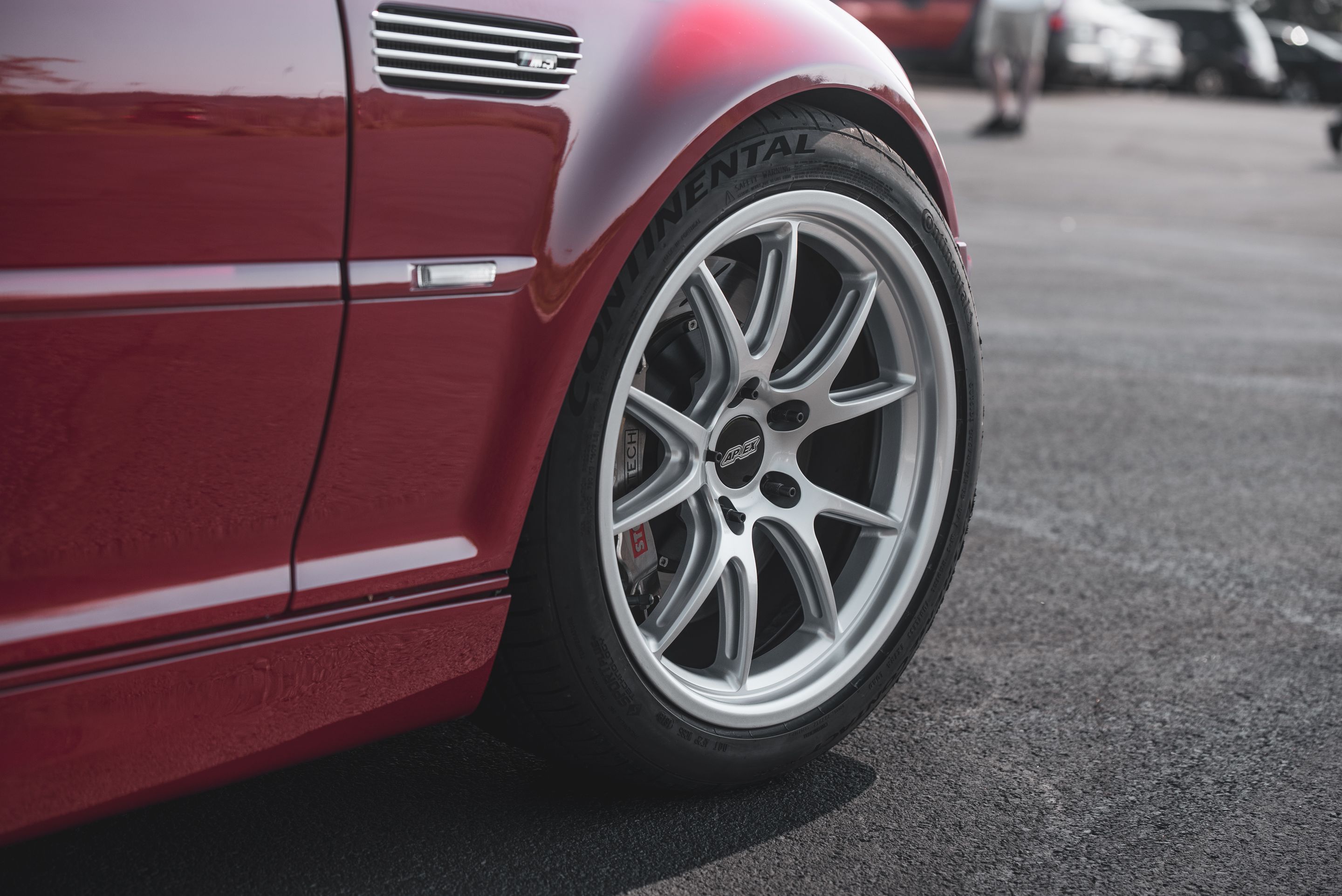 Red BMW E46 M3 with 18" FL-5 Apex wheels in Race Silver